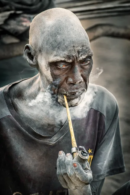 Mundari elder smoking