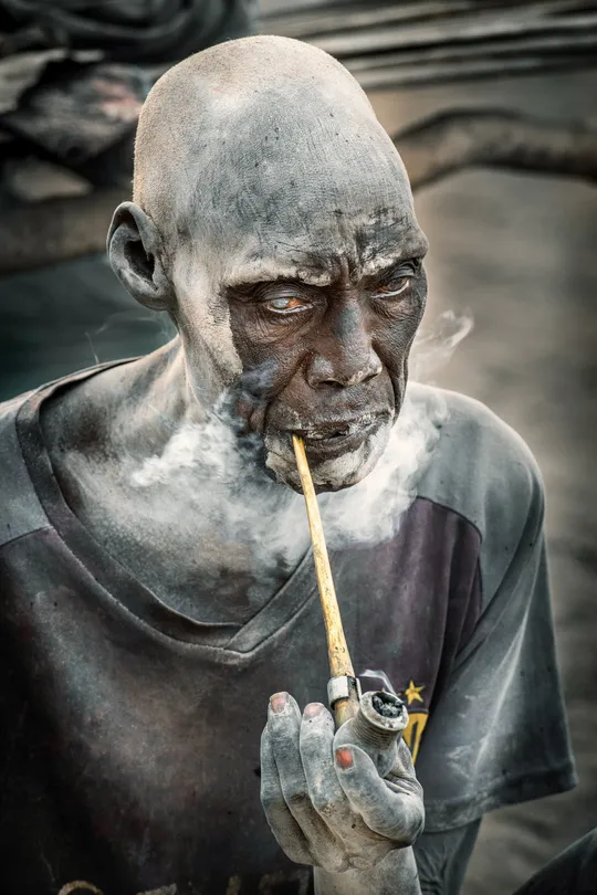Mundari elder smoking