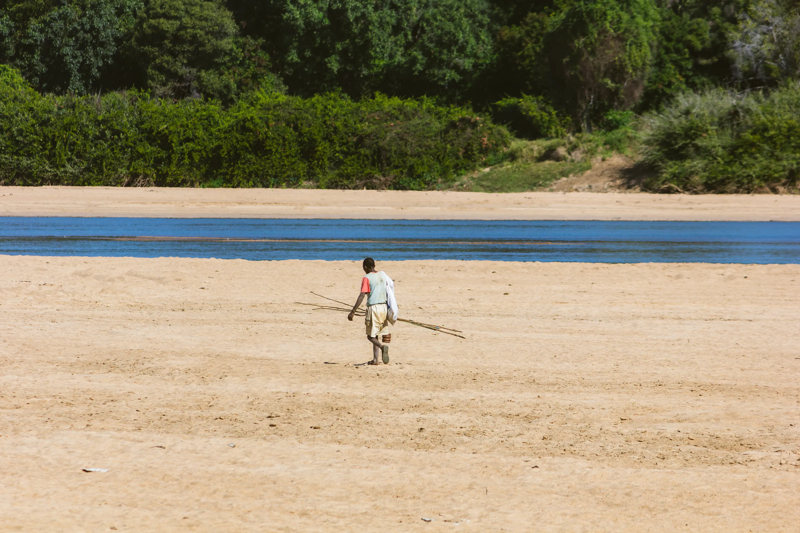 "Rhythms of the Riverside: An African Fisherman's Journey"
