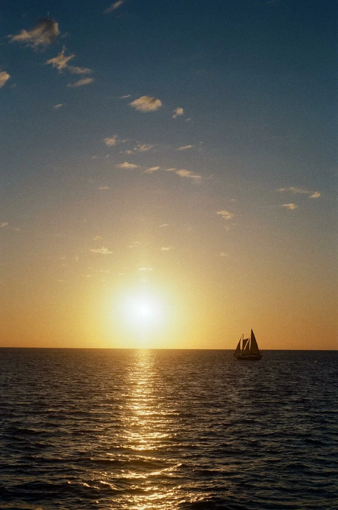 sunset and sailboat