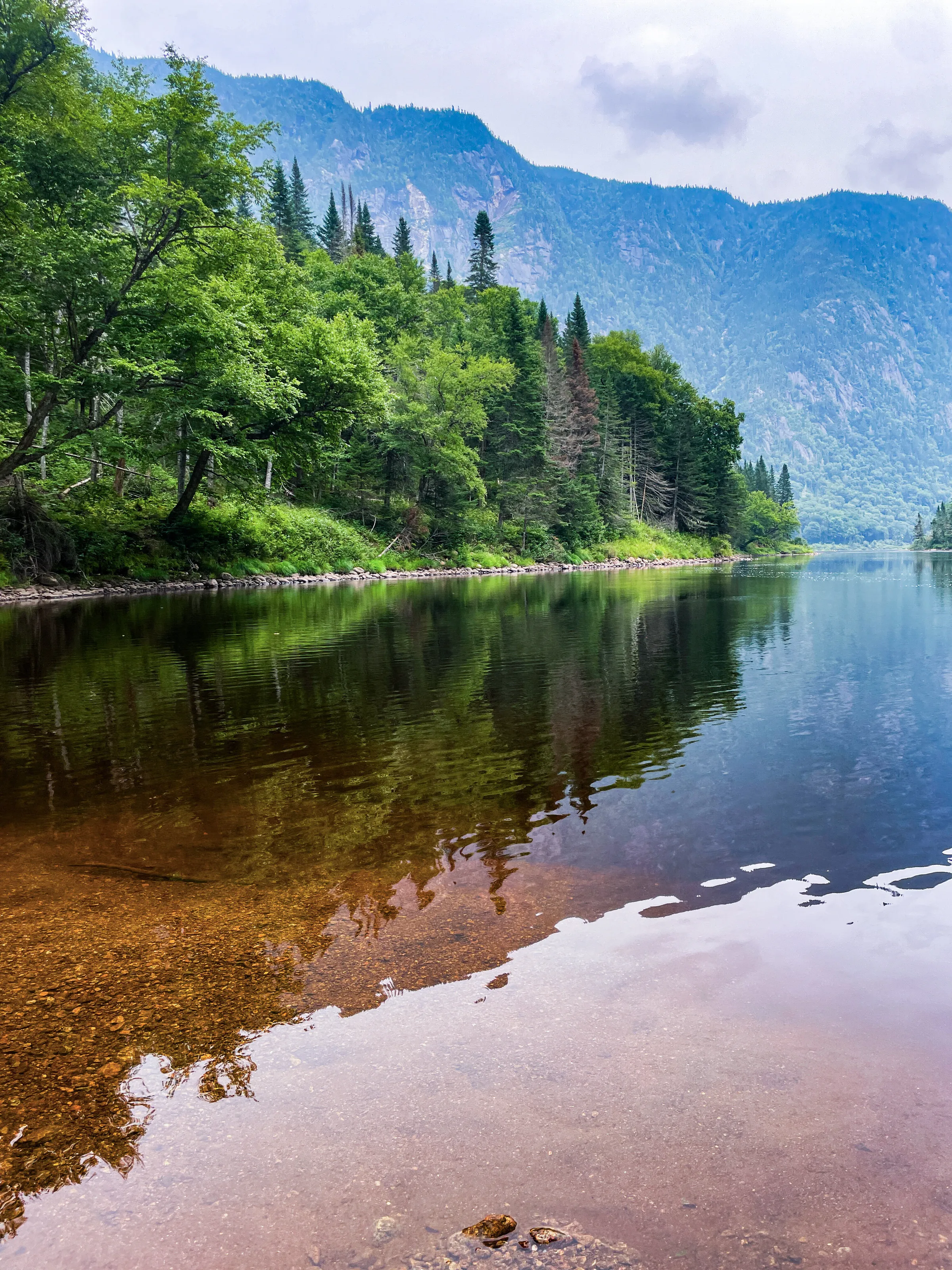 Peaceful river surrounded by mountains