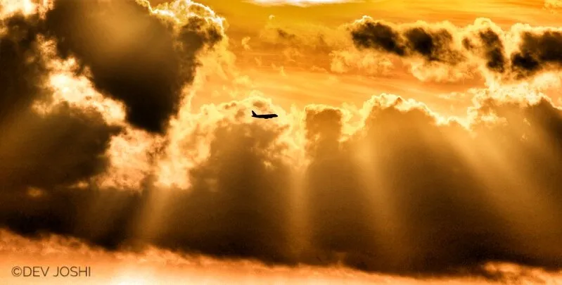Aircraft Banking away frome the sunset.