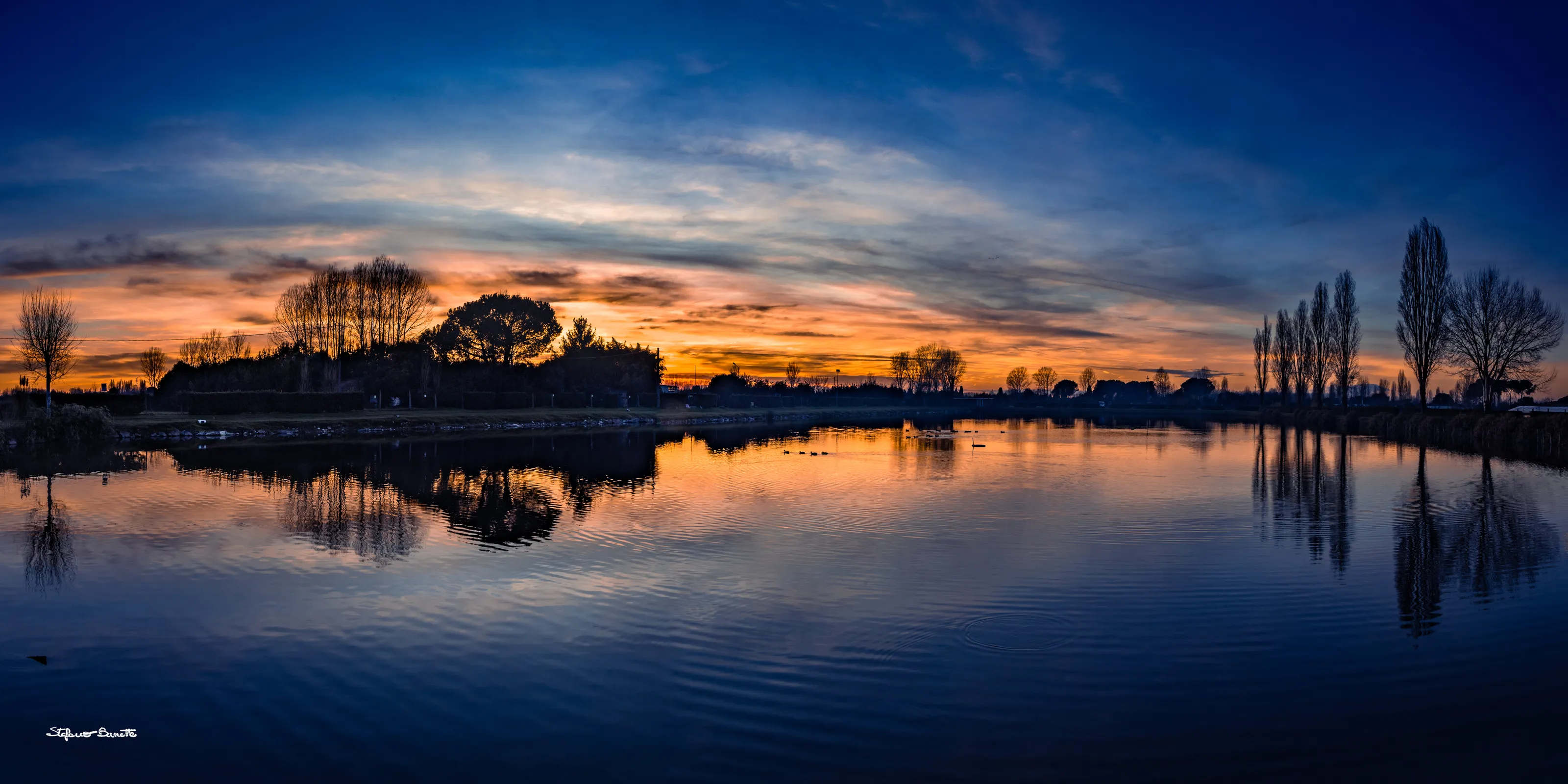 Sunset on a placid lake
