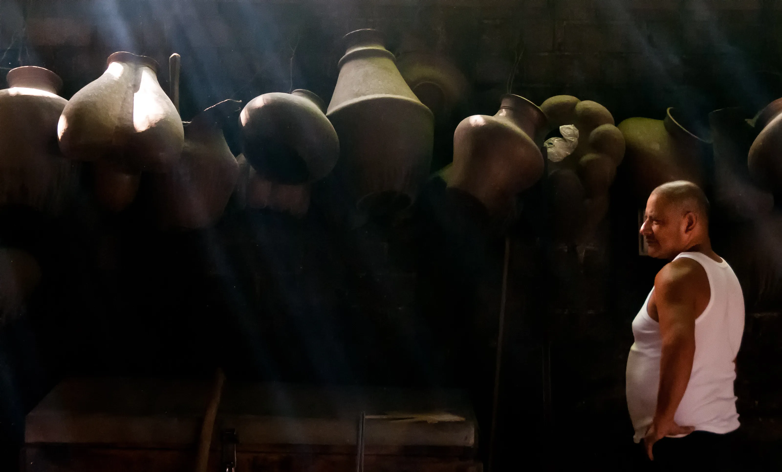 Copper Pots and Worker