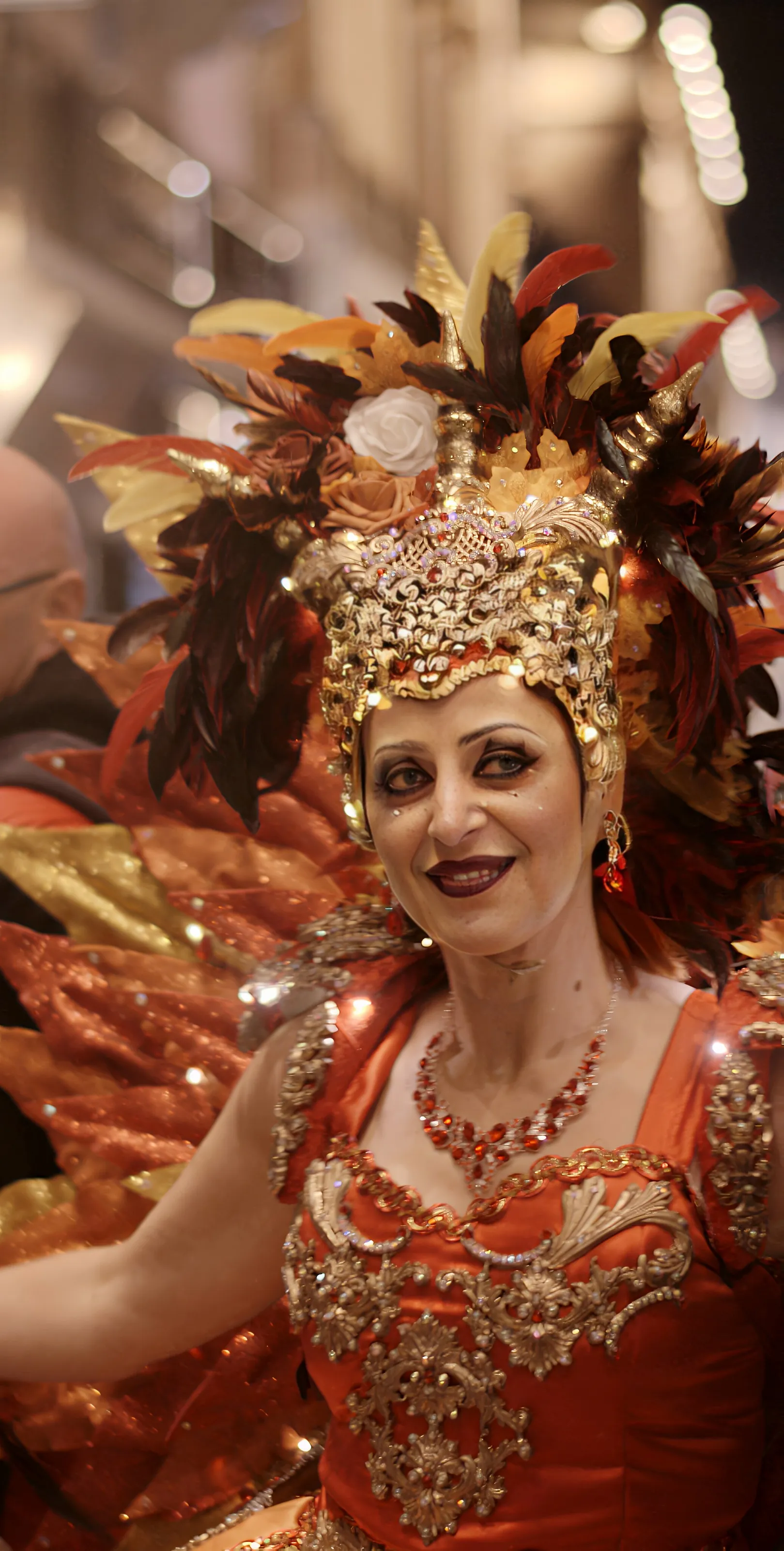 A portrait of celebration crowned in feathers.