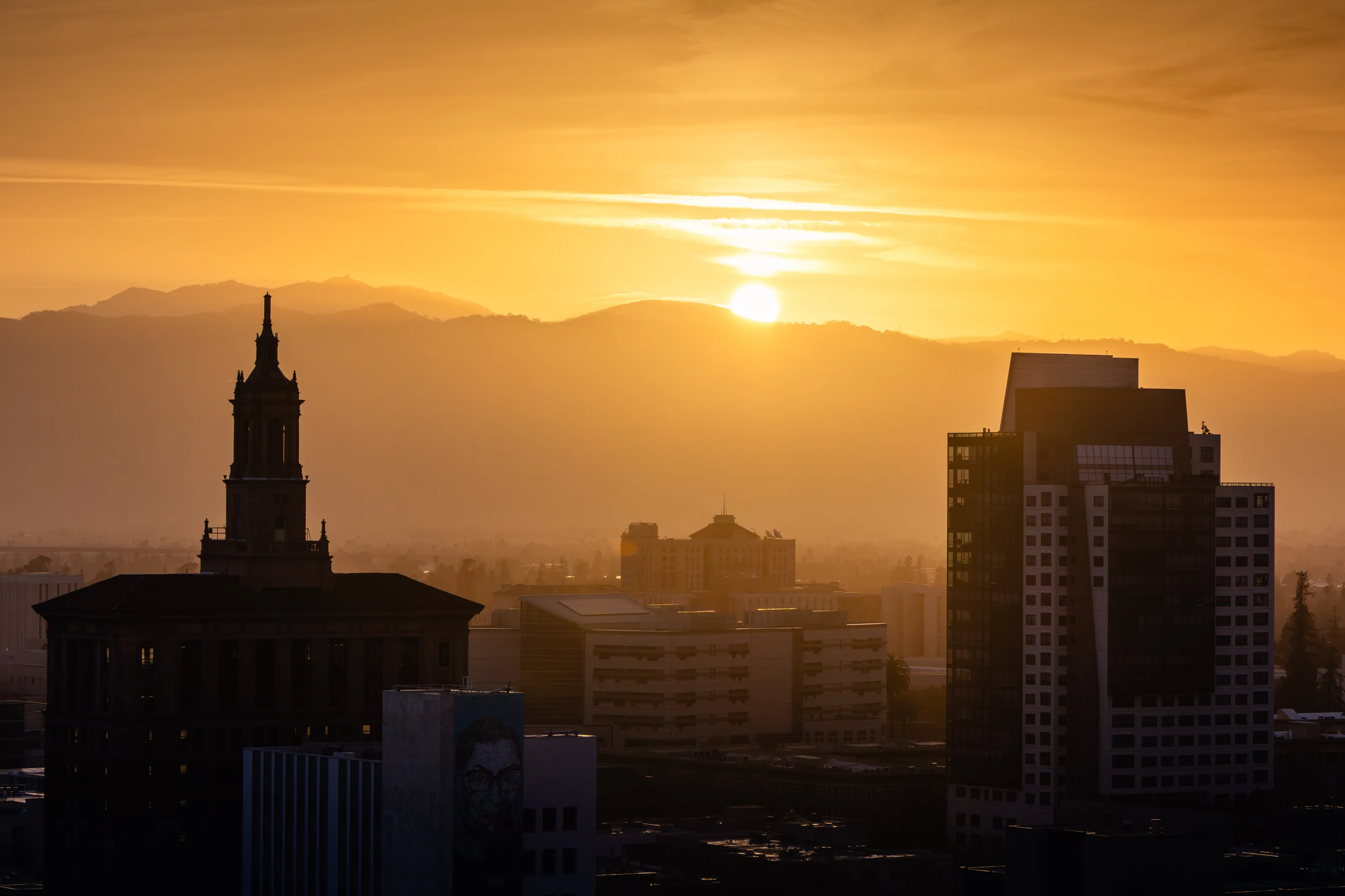 Downtown San Jose Skyline with Golden Sunset Over the Mountains