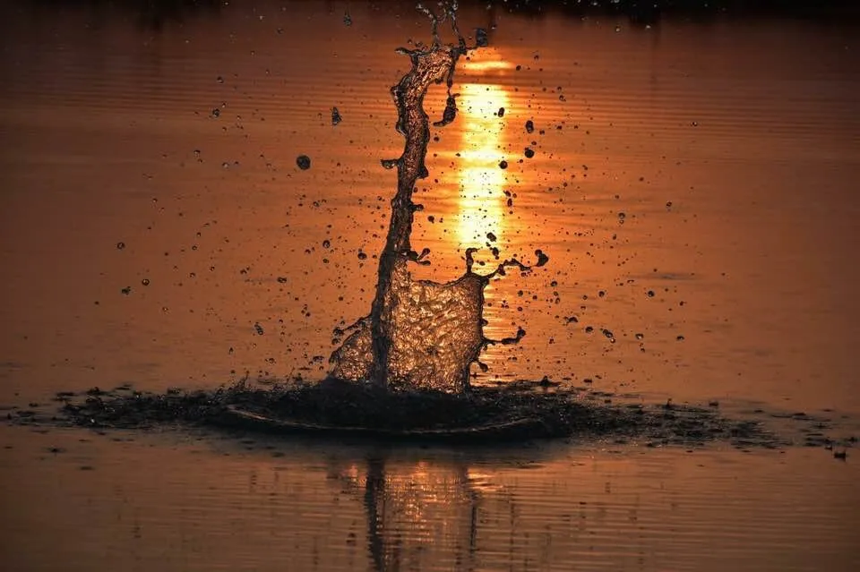 Water splash on sunset