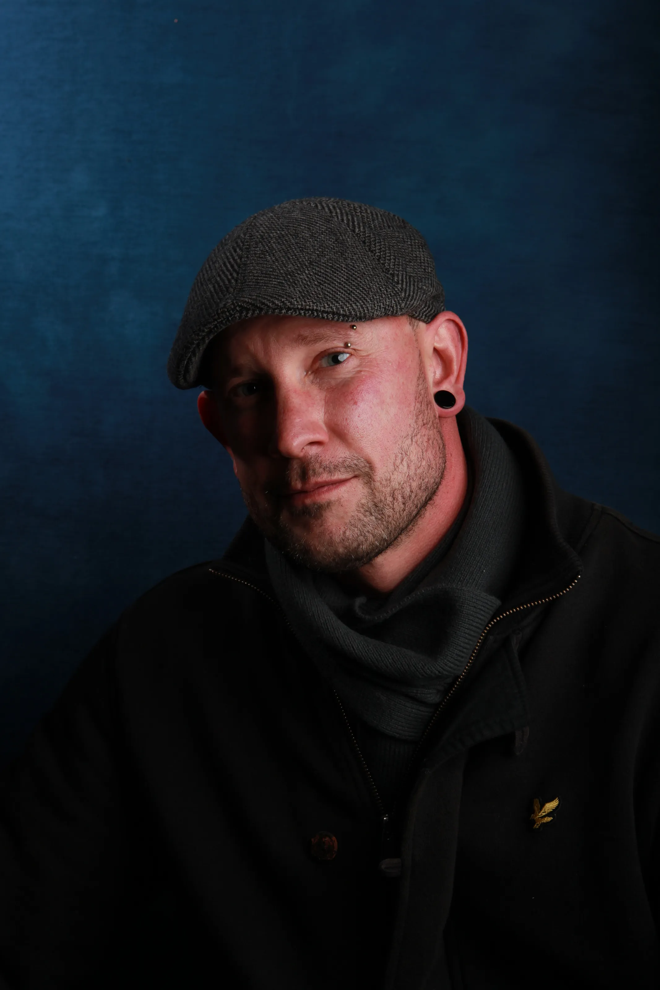 Flat cap and man