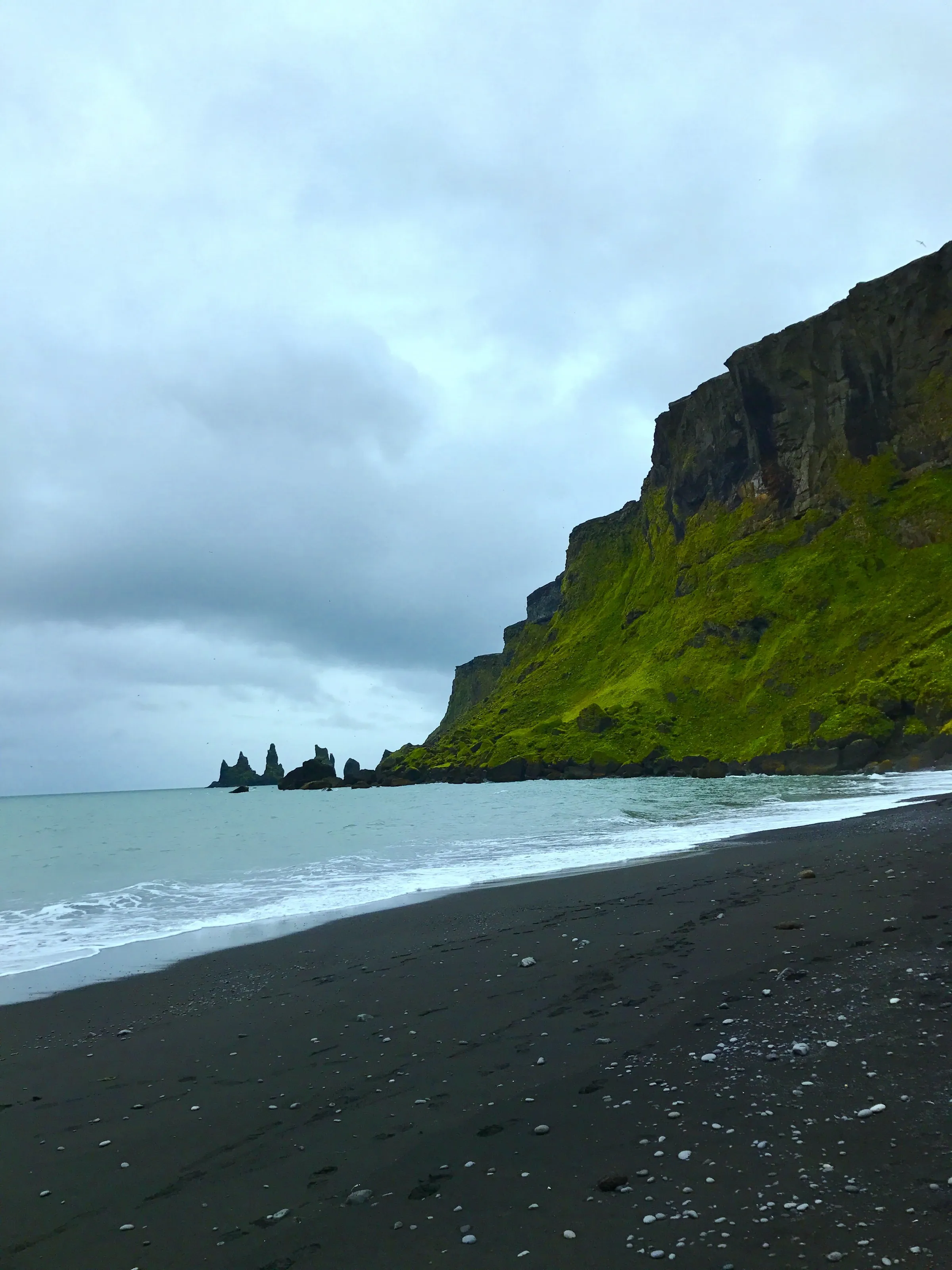 Touch of the Ocean on a Black Lava Sand Beach