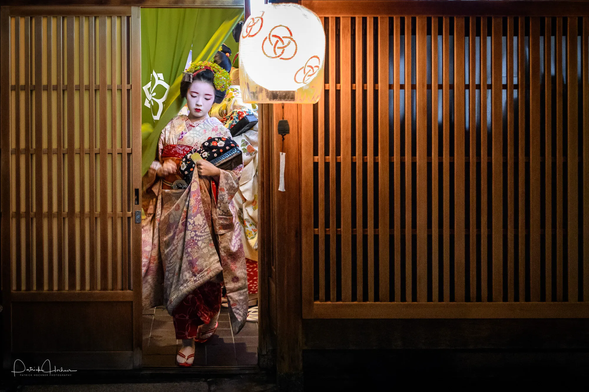 Maiko Fukukana leaving her Okiya on her way to work