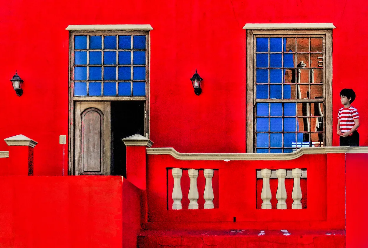 little boy outside his house in the bo kaap