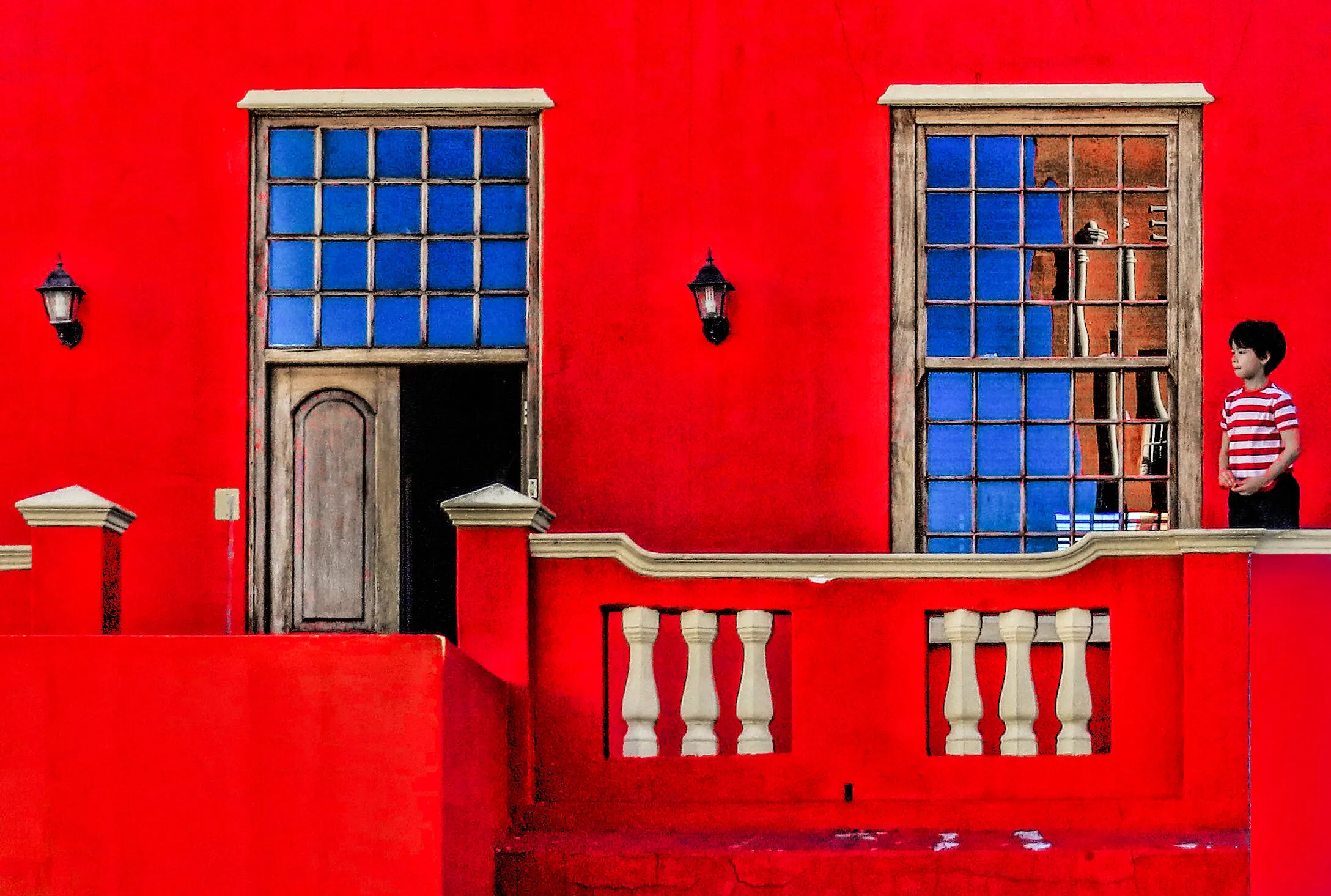 little boy outside his house in the bo kaap