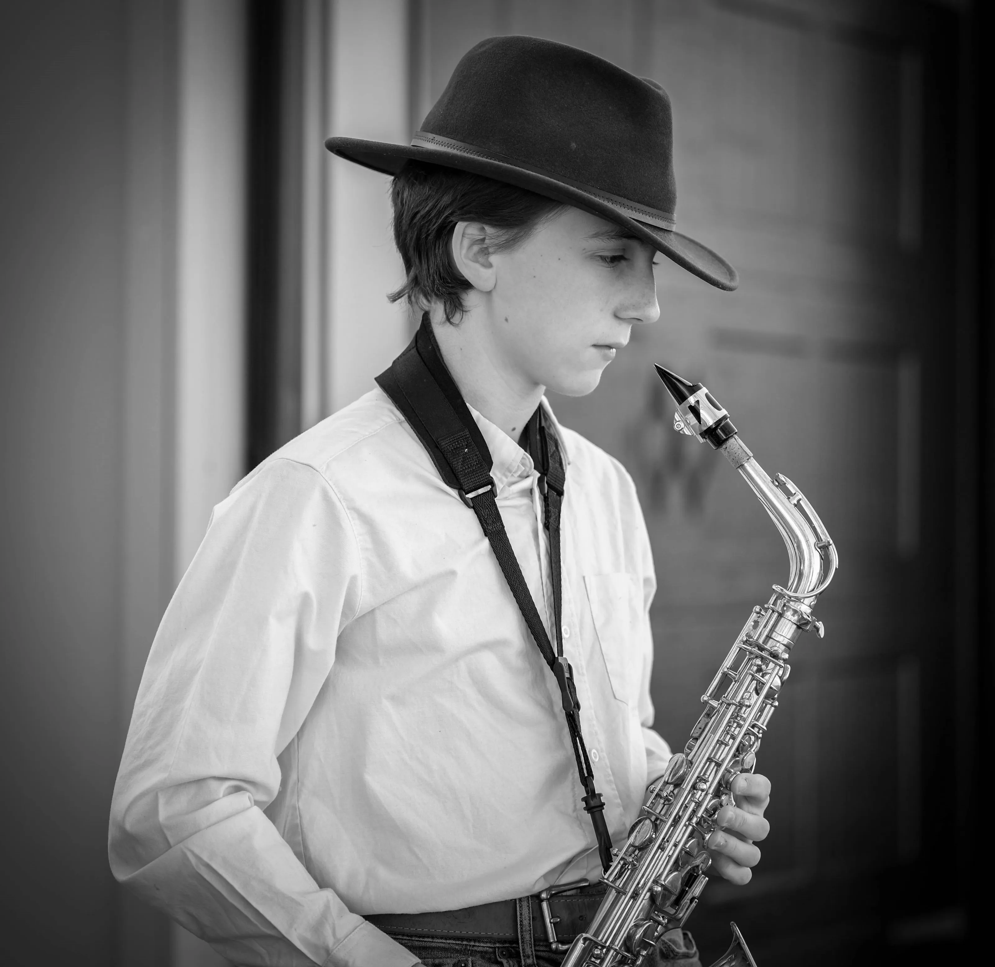 People Playing the Saxophone in Black and White