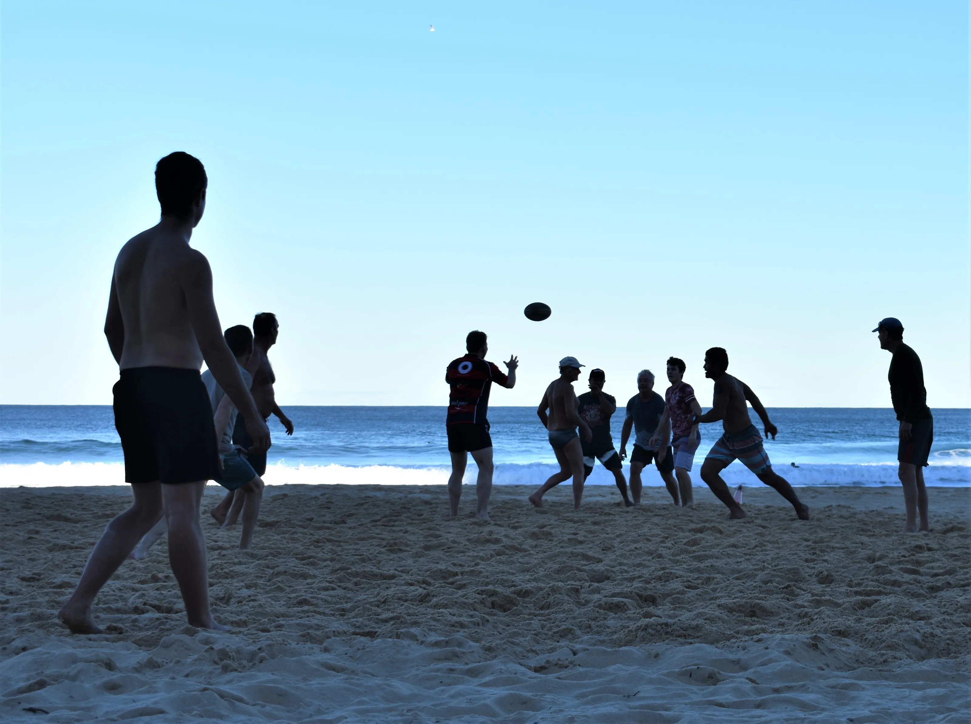 People Playing Ball Games on the Beach
