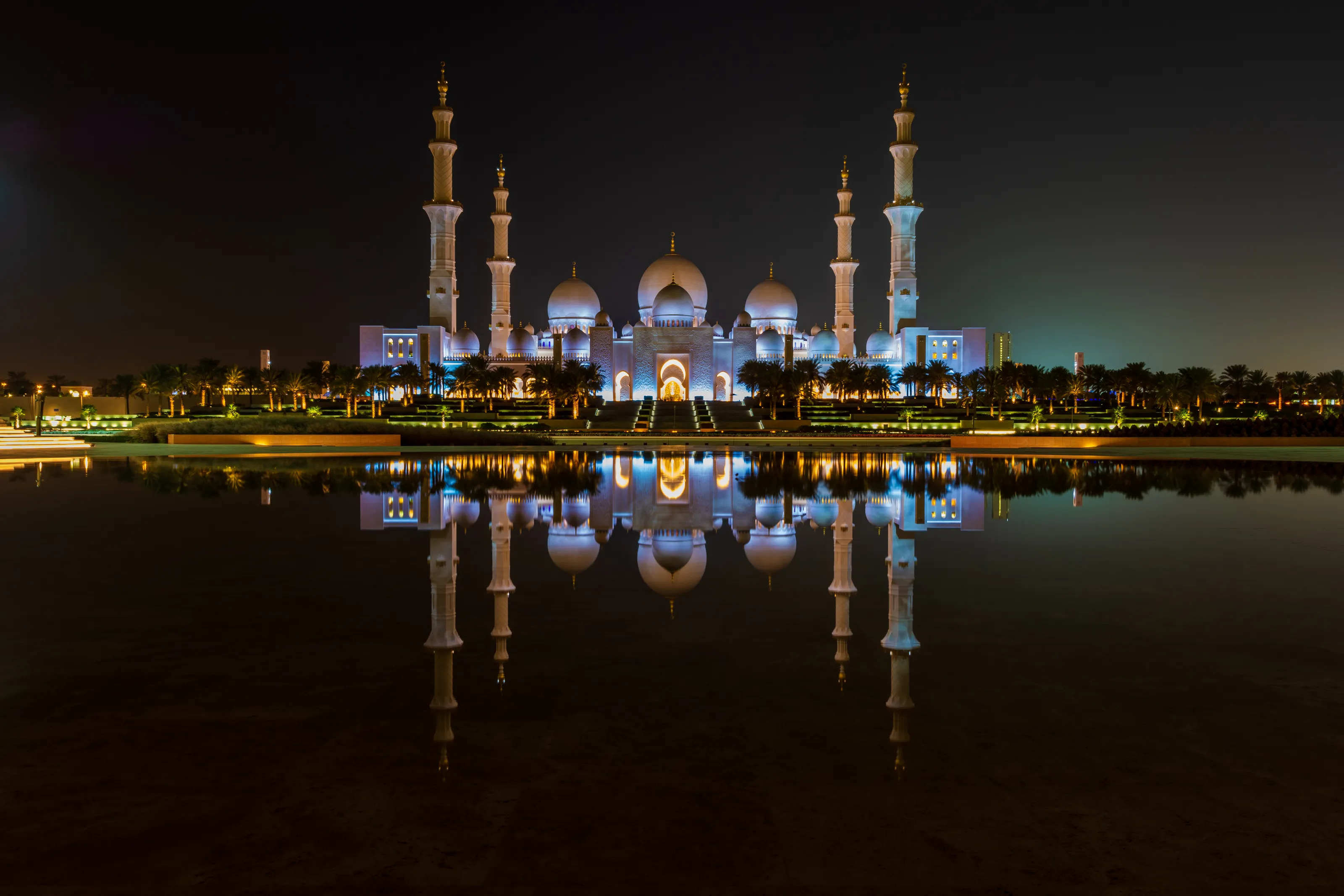 Buildings And Their Reflections In Water