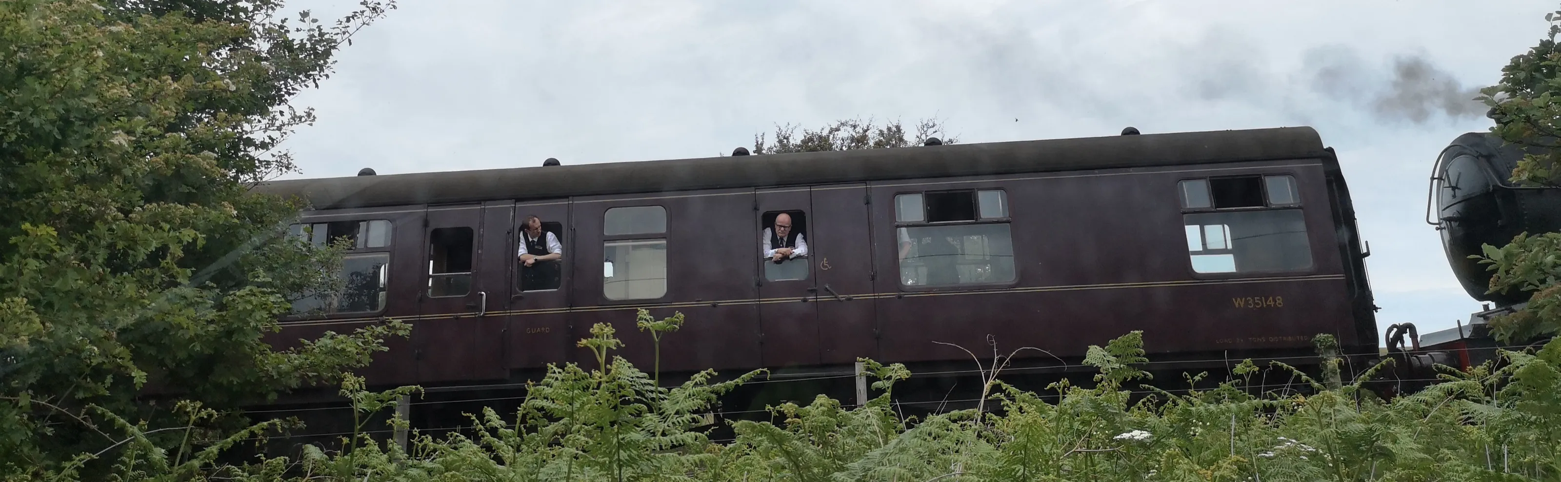 People Looking Out of a Train Window
