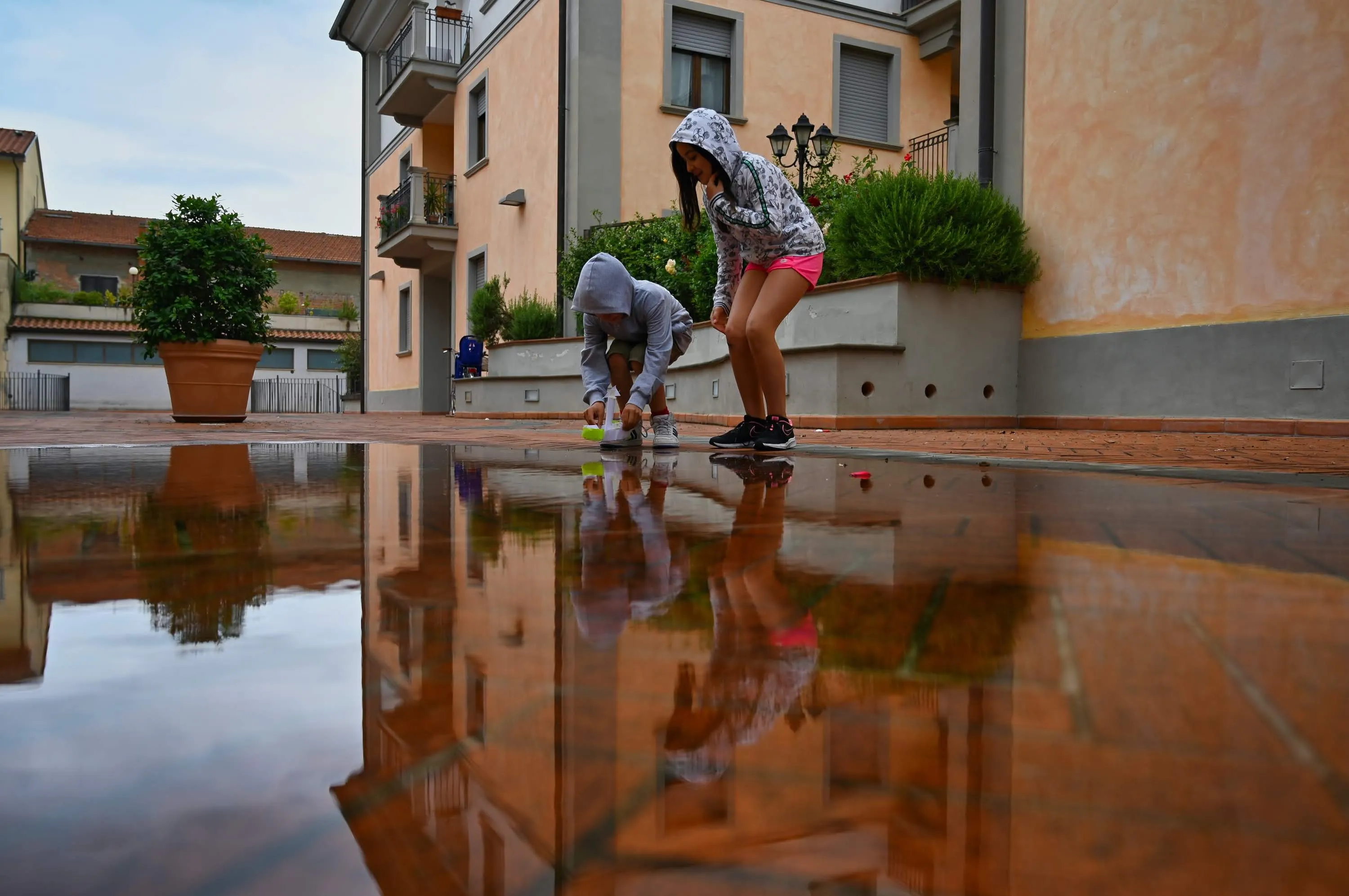 Children Playing in Puddles