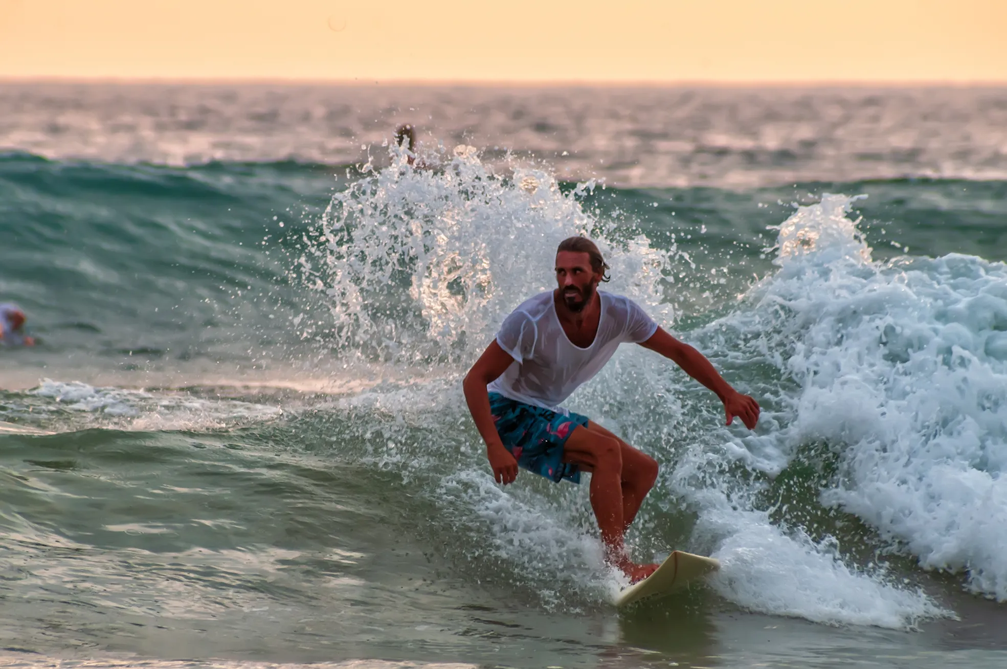 People Riding a Wave