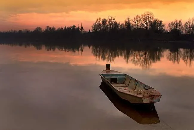 Small Open Boats on Lakes at Sunrise or Sunset
