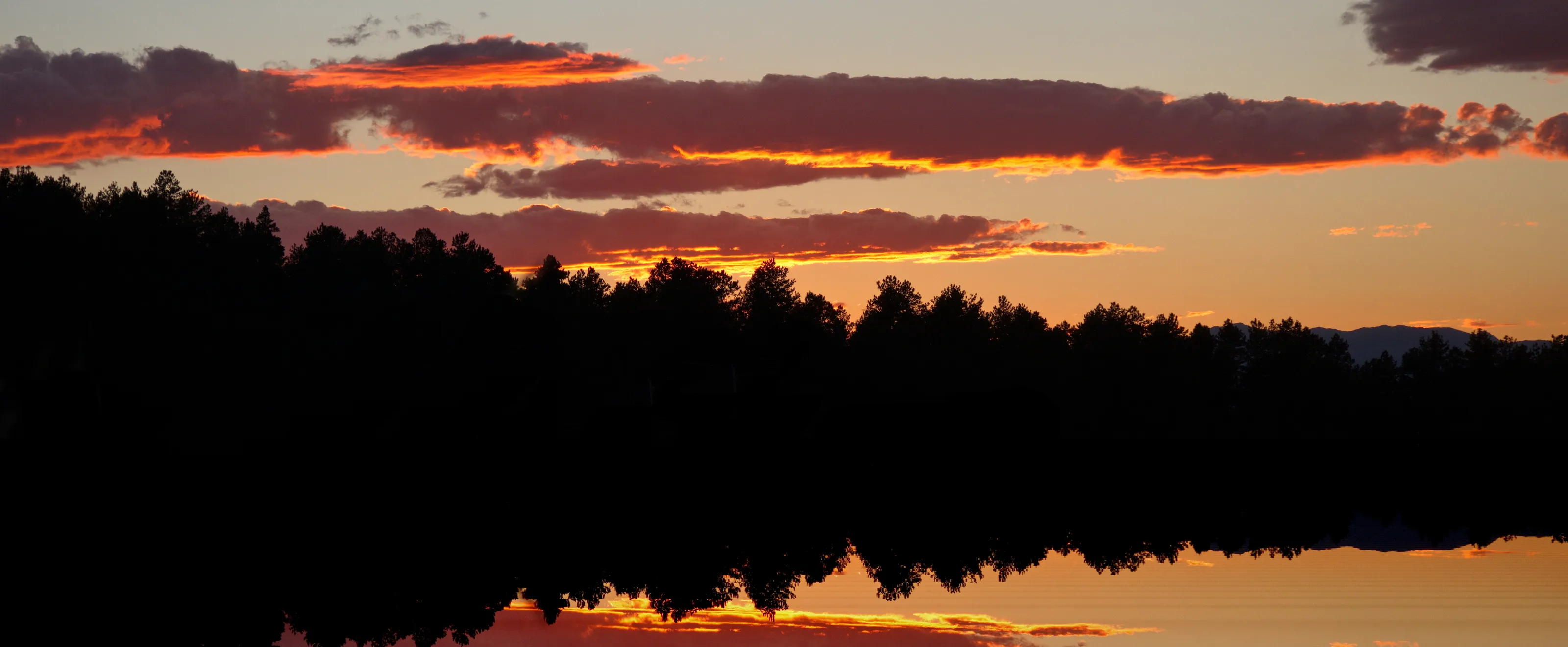 Sunrise or Sunset Reflected on Water