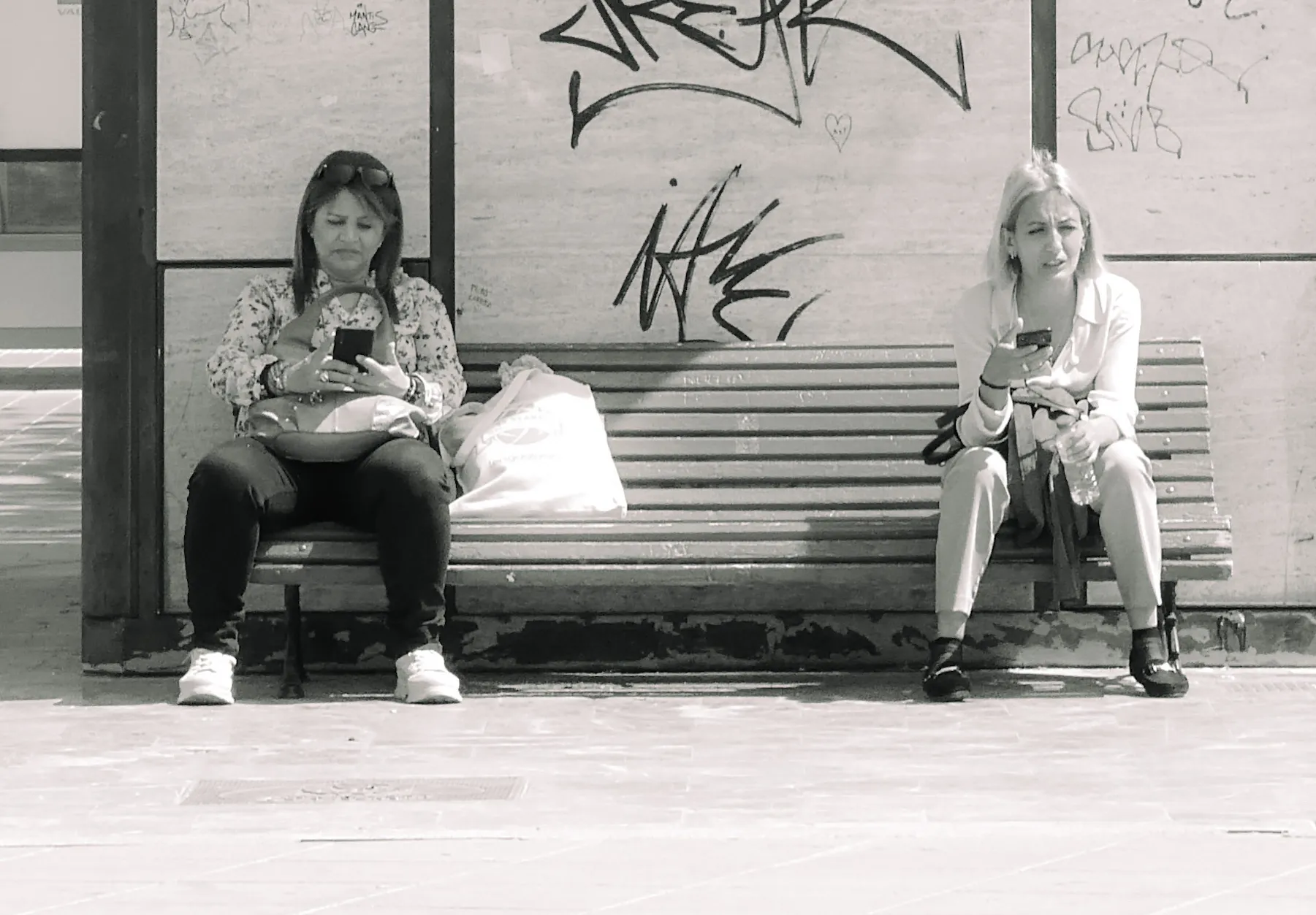 People Sitting Down in Black and White