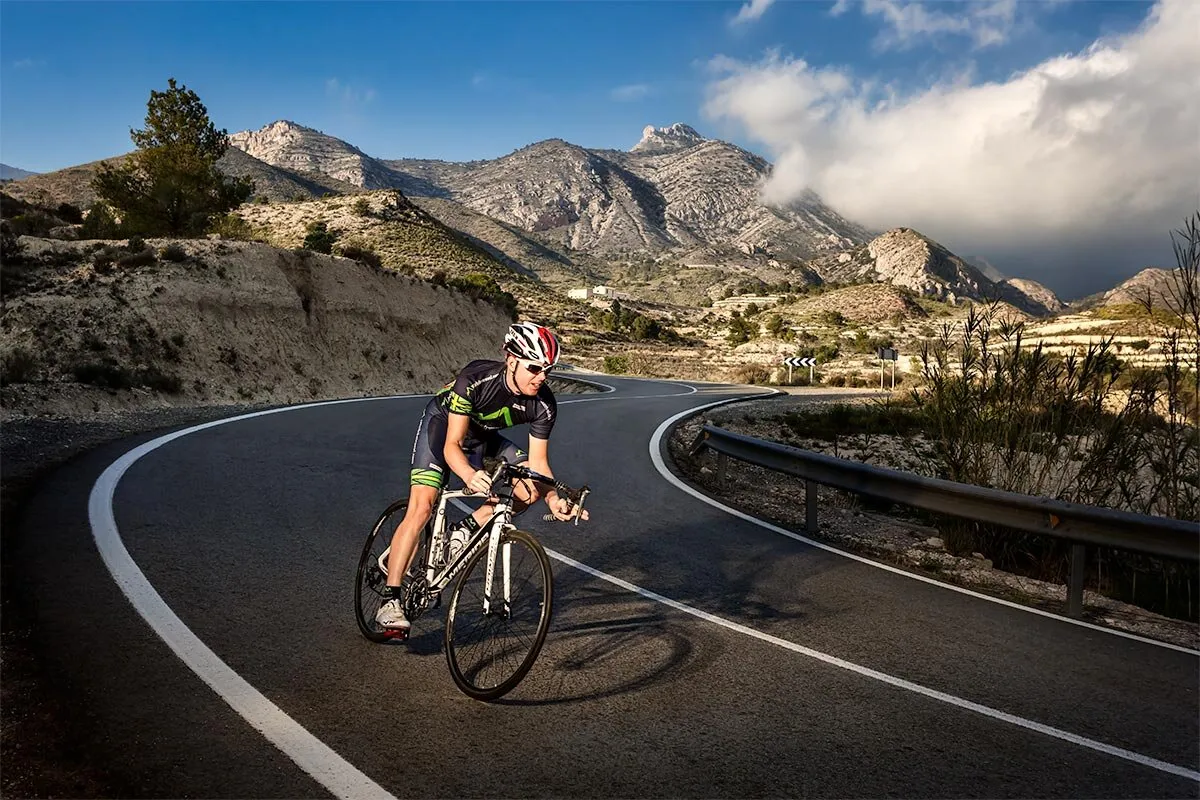Cyclist descending on the mountain road