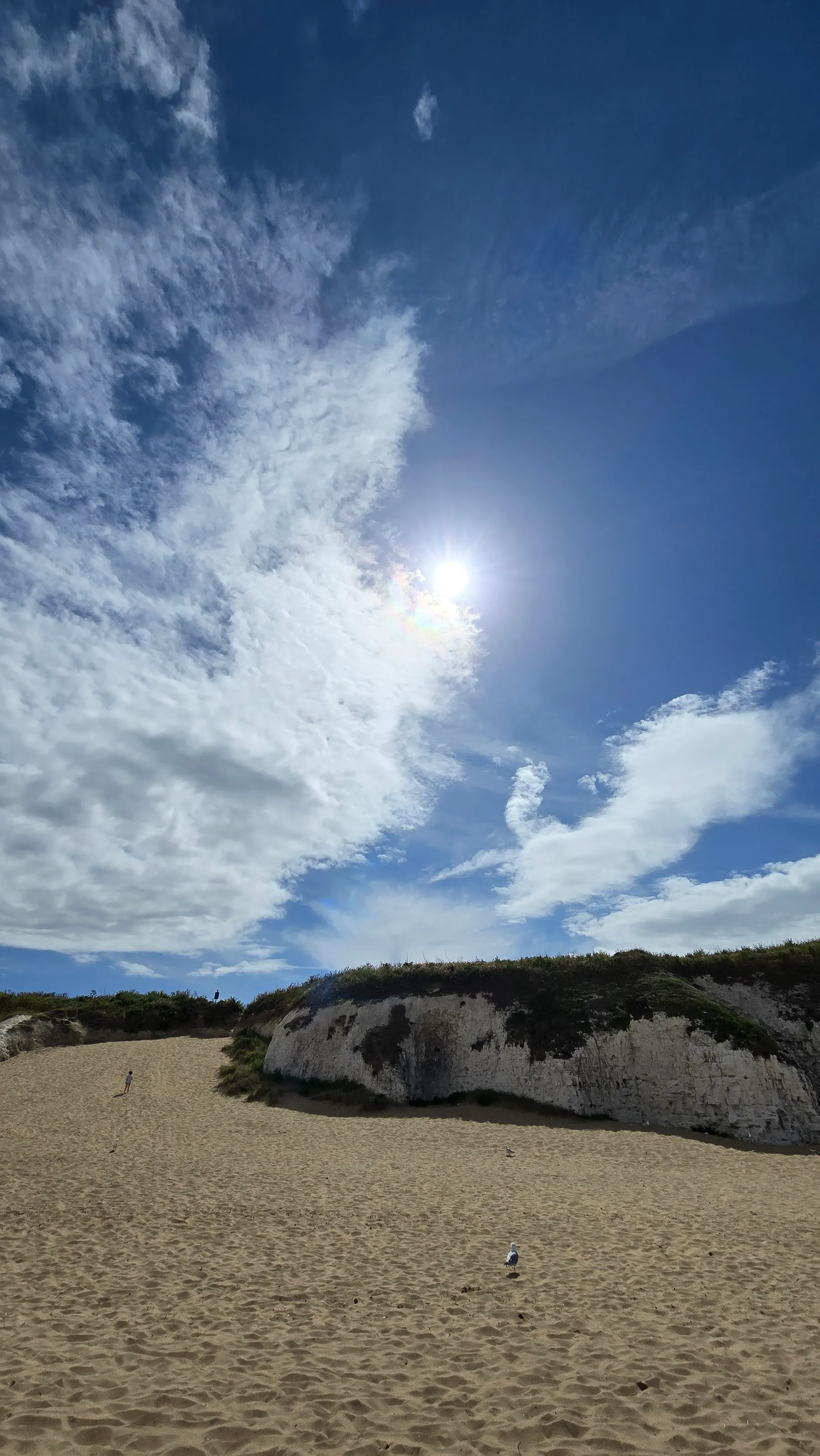 Blue sky with intermittent clouds
