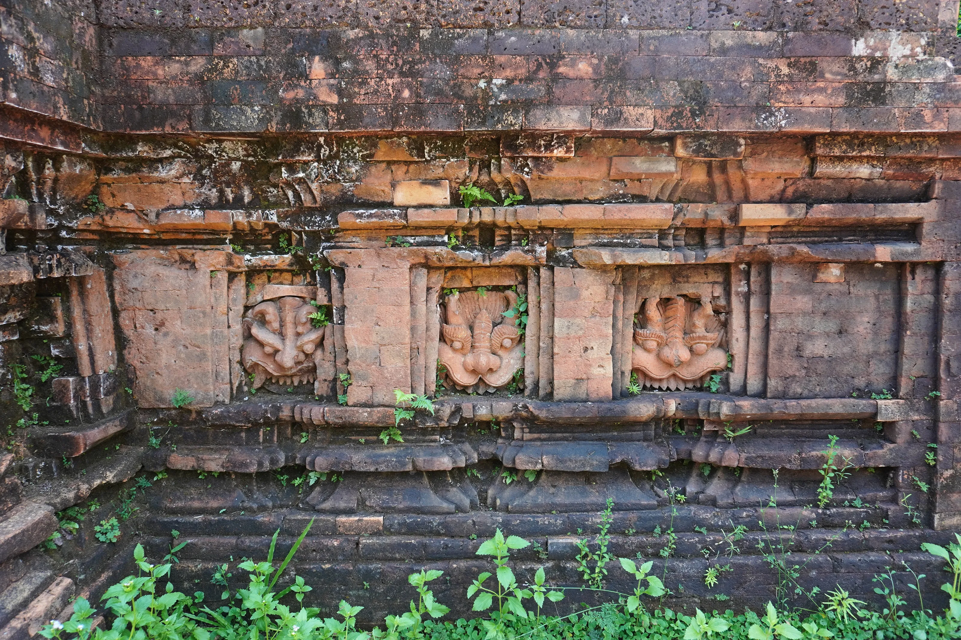 Faces on an ancient temple in My Son Sanctuary, Vietnam
