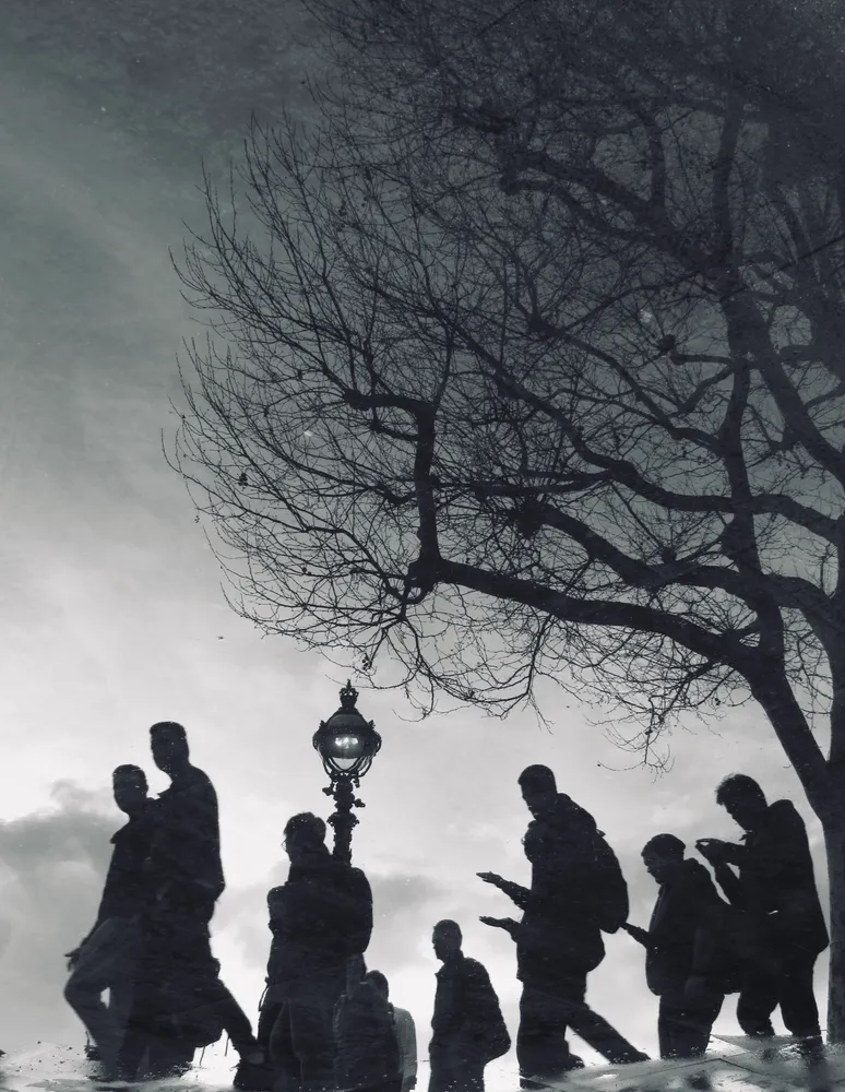 Street silhouettes reflected on Southbank