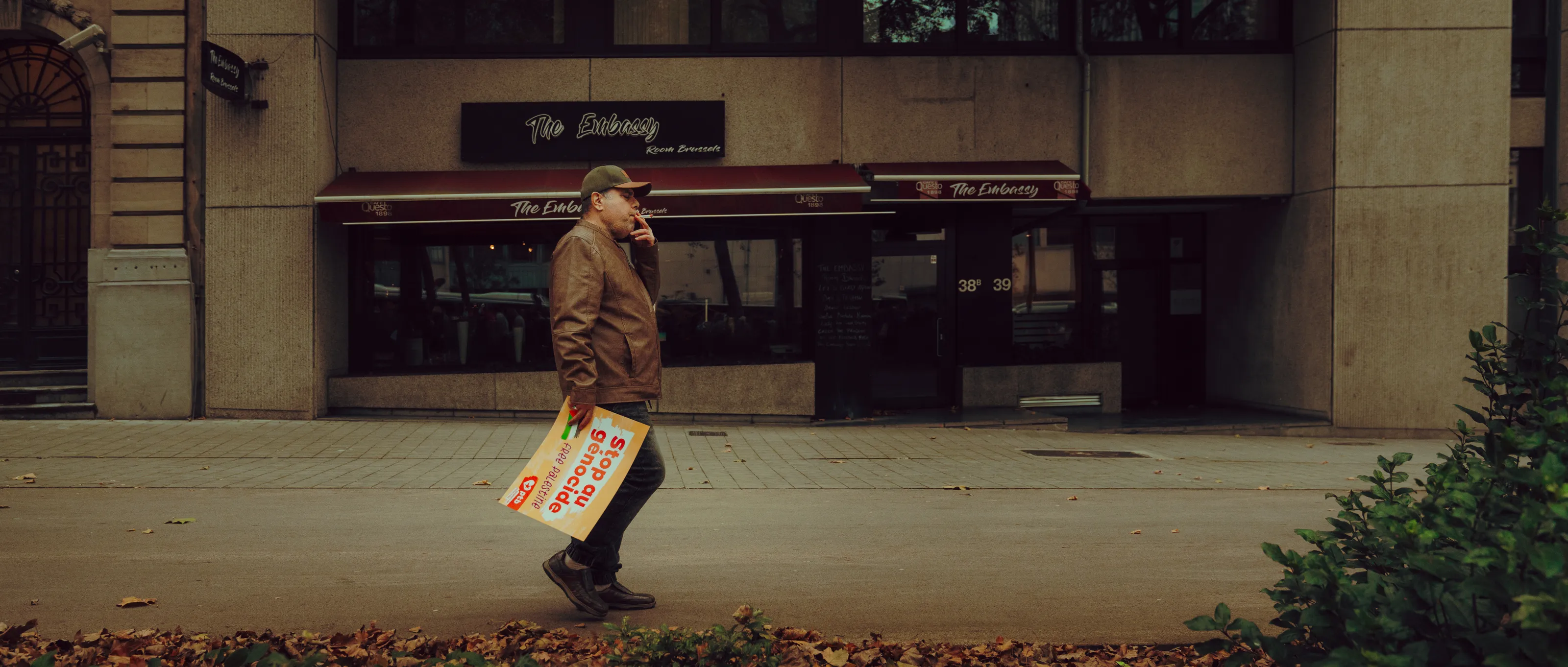 Protester walking and smoking a cigarette