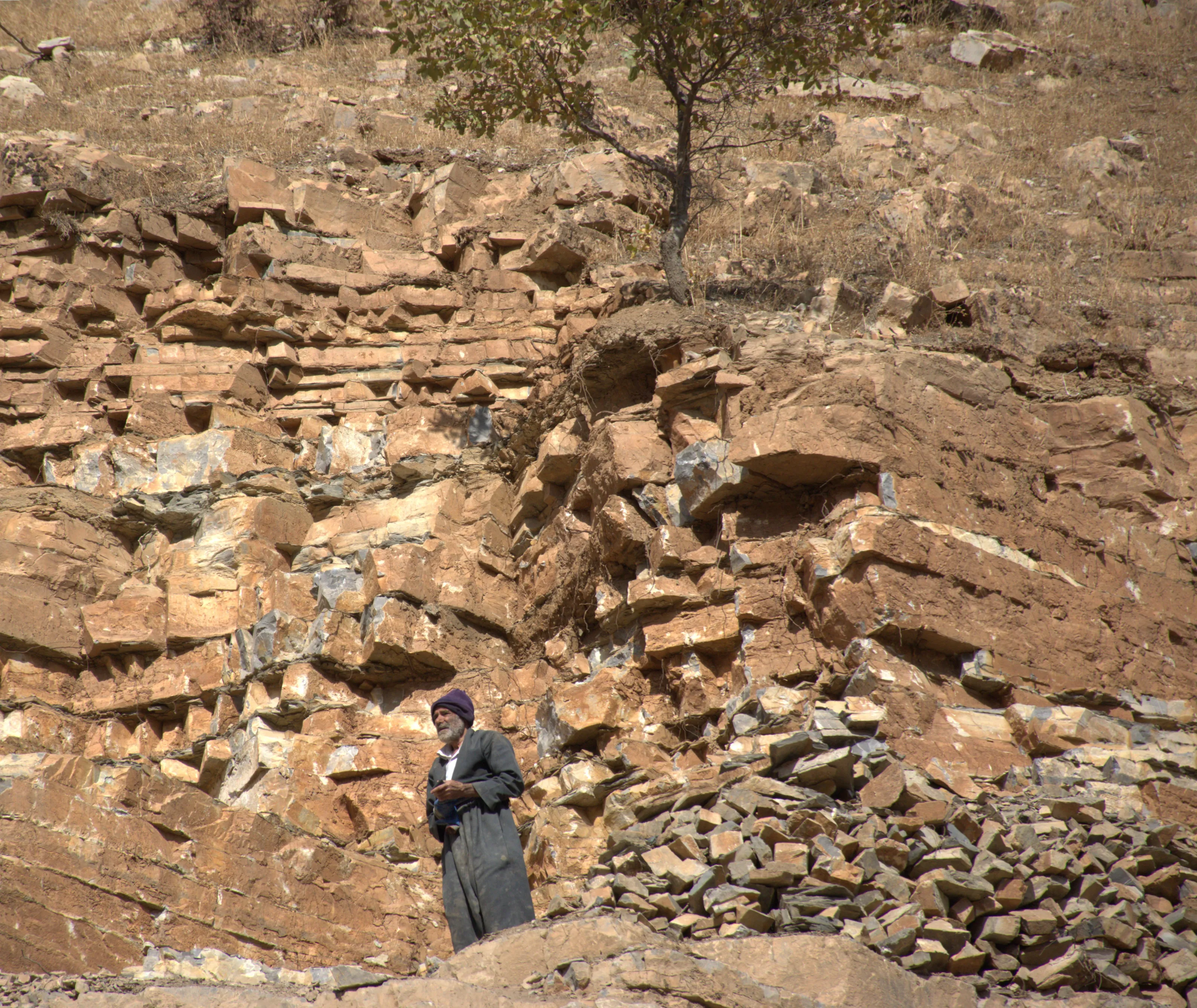 “Man and stone — two silent witnesses of nature’s timeless story