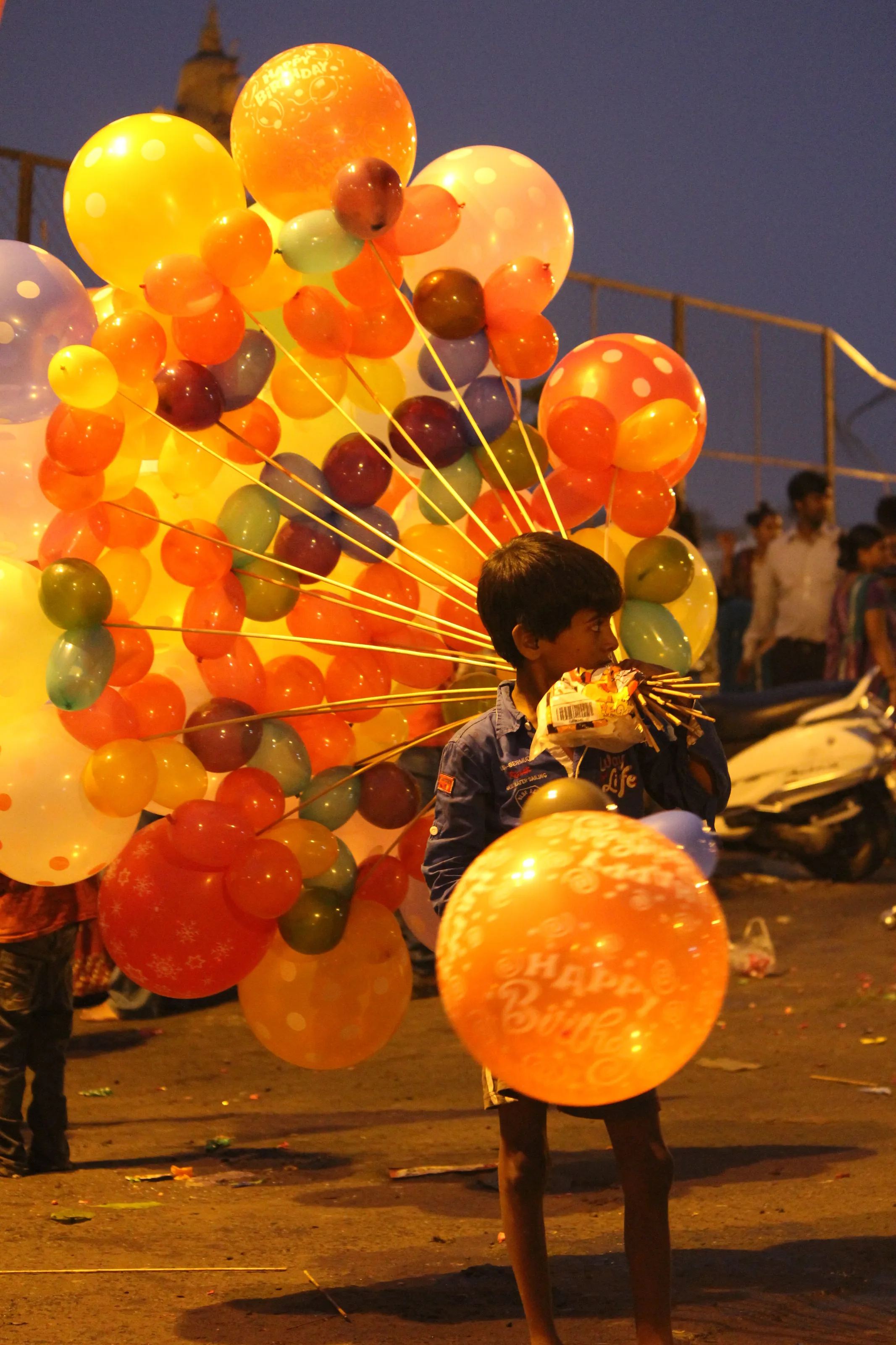 Children seeling balloons.