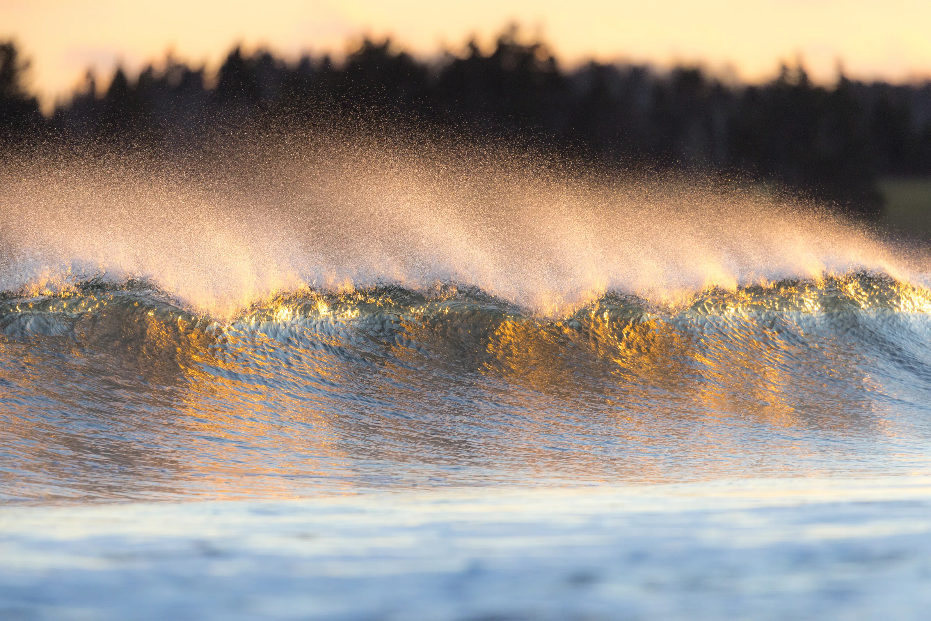 Crashing waves at sunset