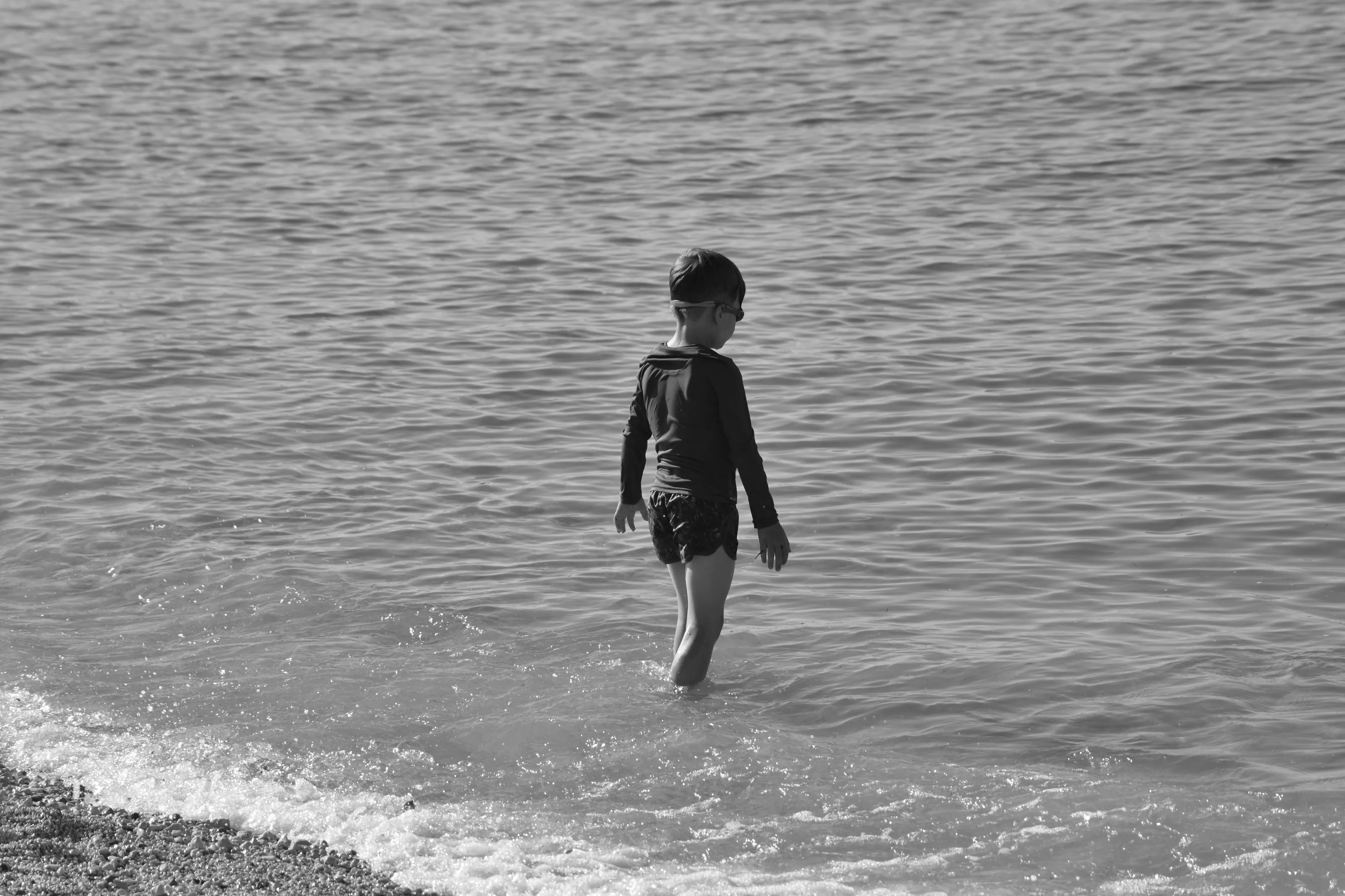 Child playing in the sea