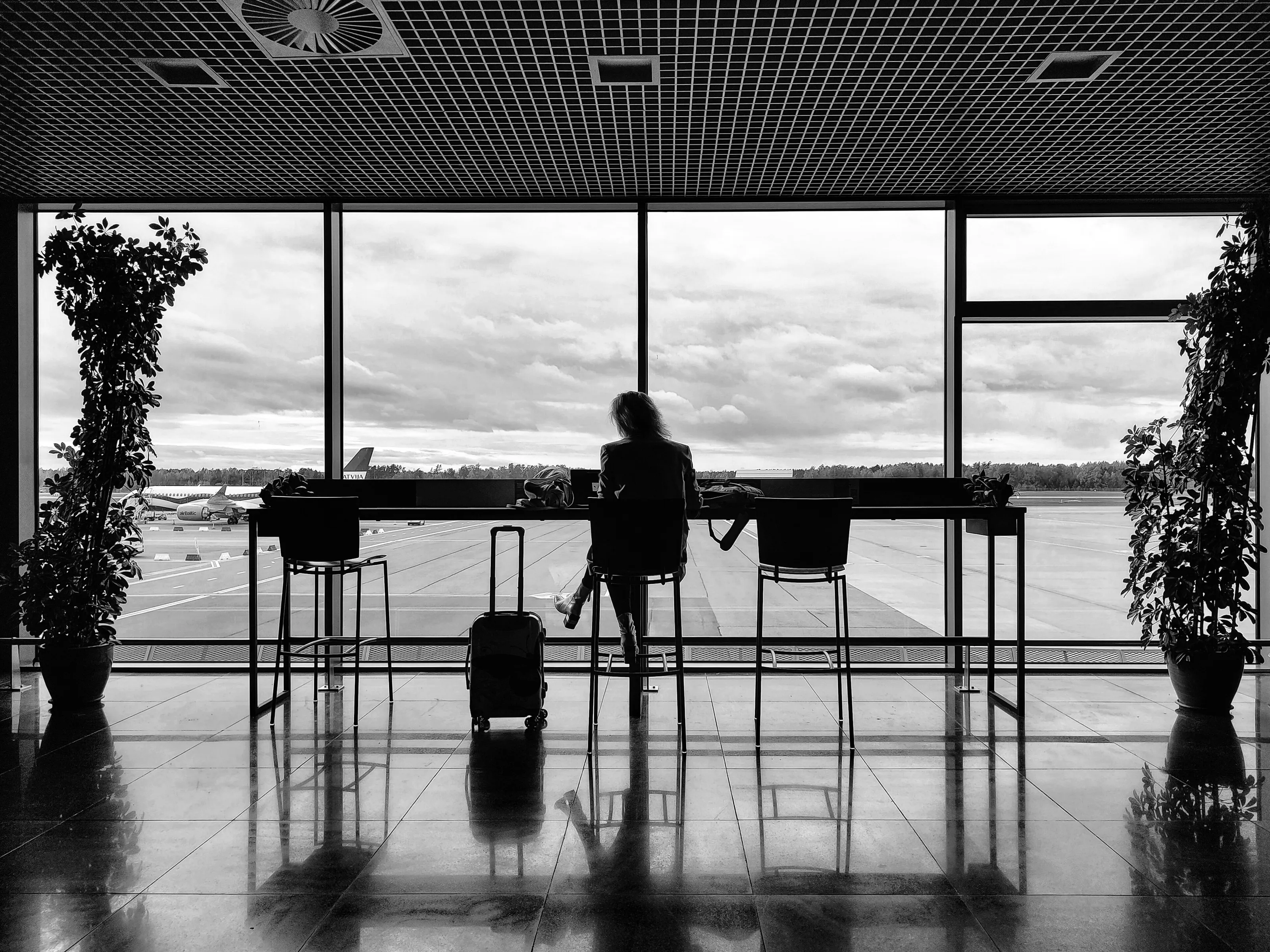 People Travelling in Black and White