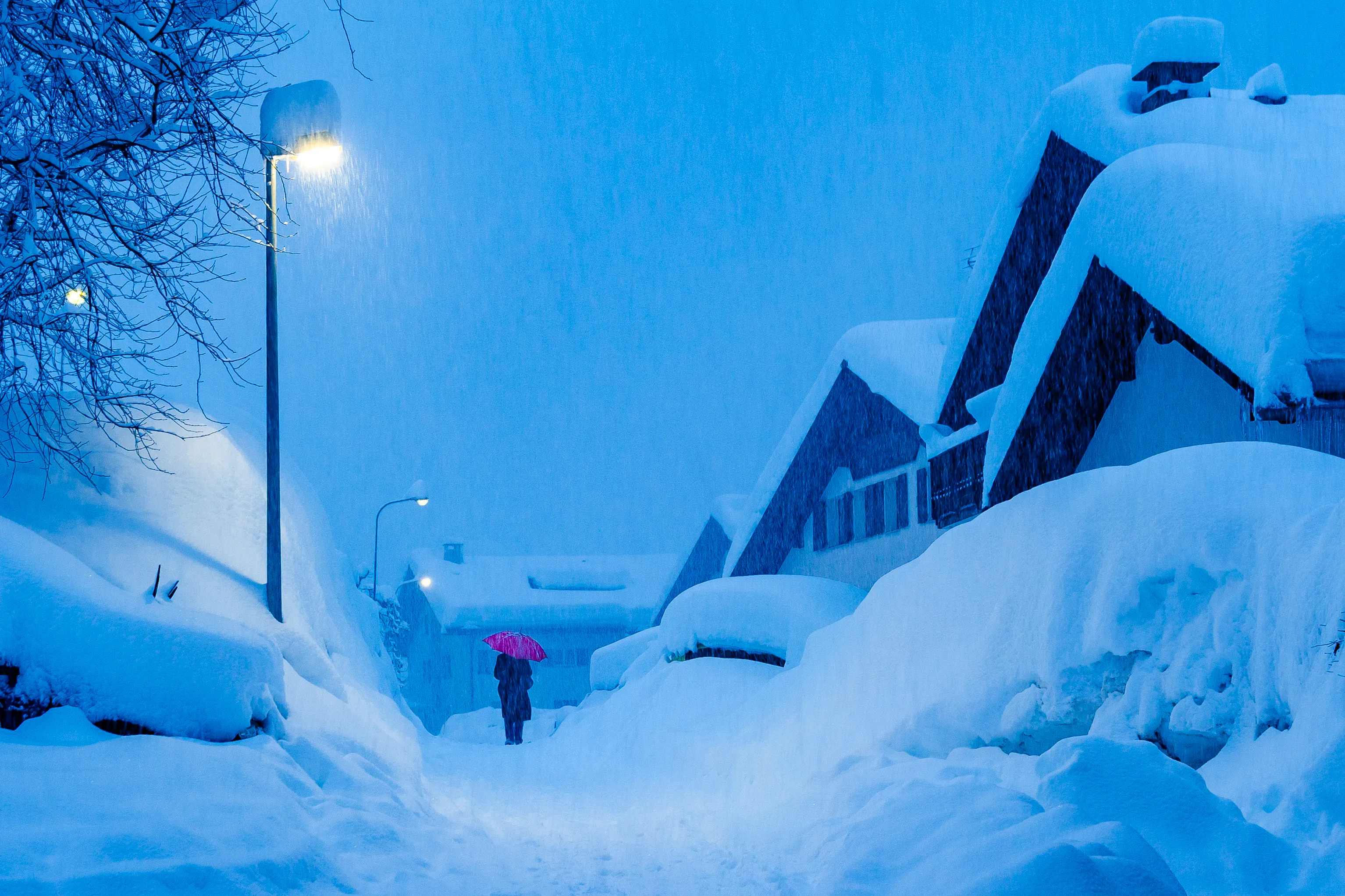 Heavy snowfall in Klosters, Switzerland, at dusk