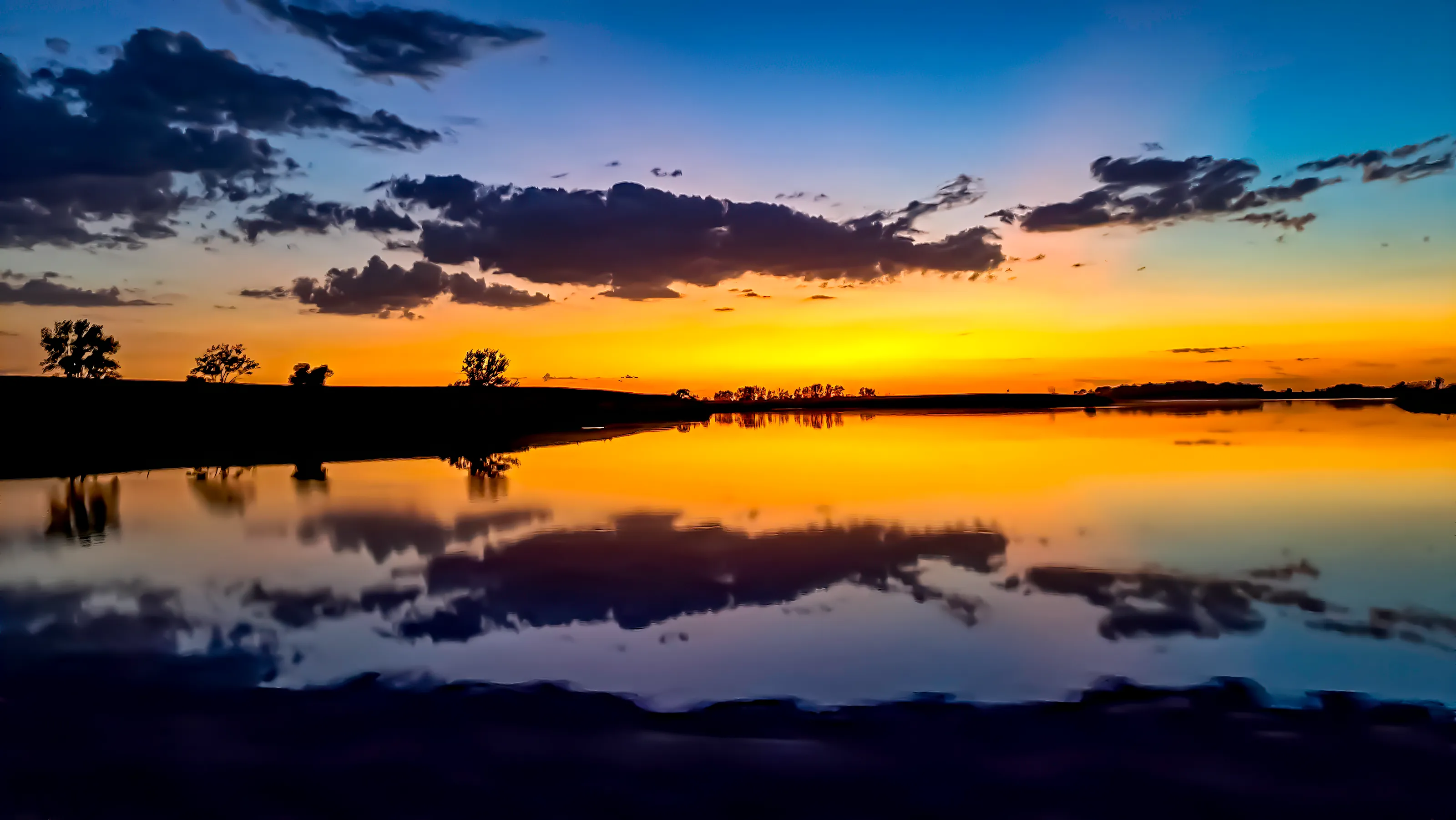 South Dakota sunset over serene body of water