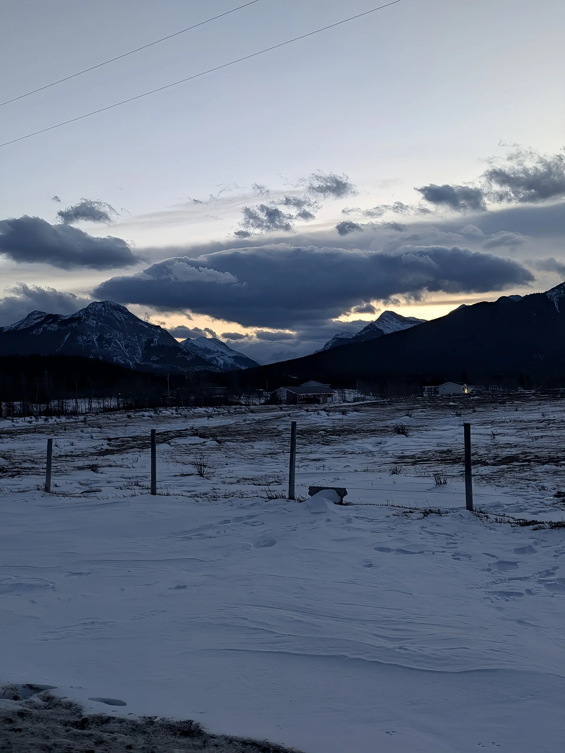 Thresholds of the Rockies: Where sunset fades into the deep mountain night.
