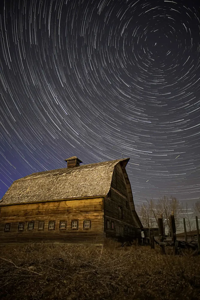 Star trail around a western barn