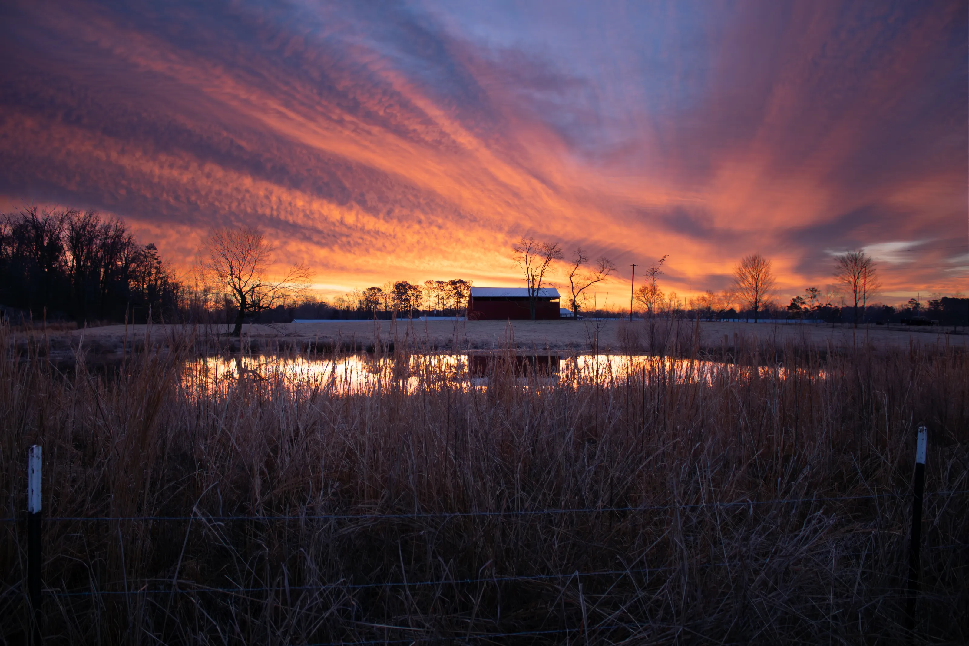 Spring sunrise over the red barn