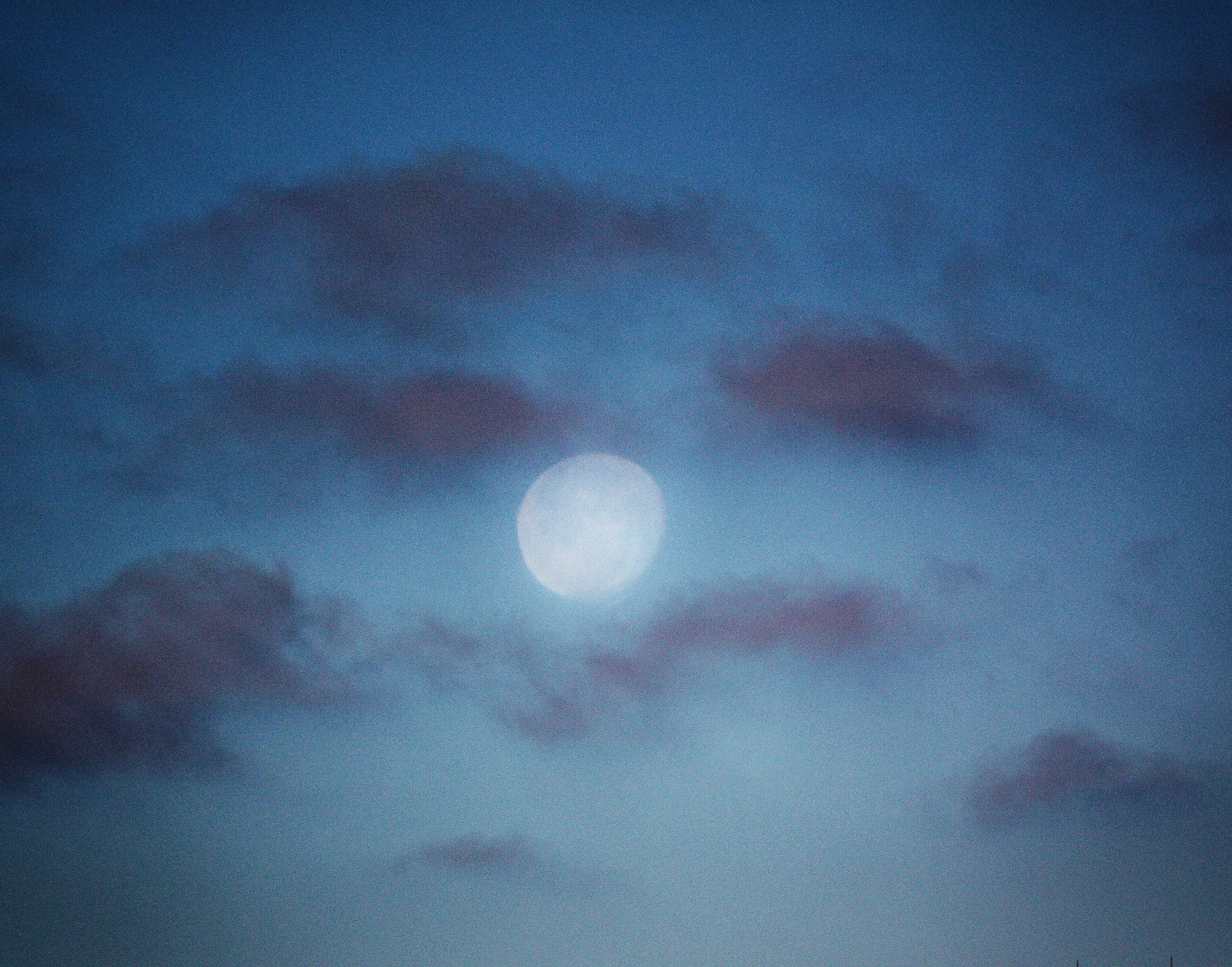 Moon with darks clouds.