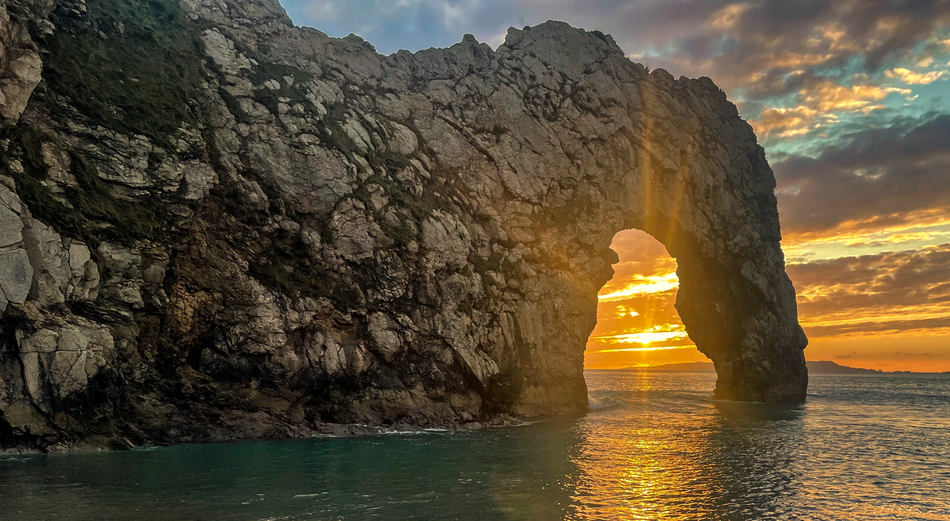 Sun setting through the door