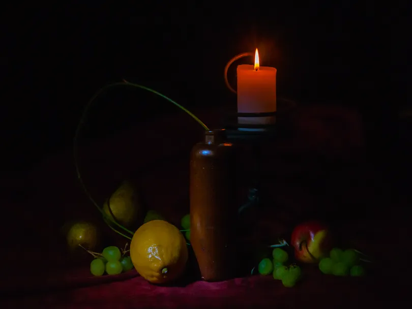 Still life with candle and fruit