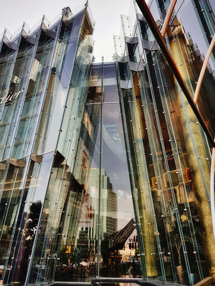 High-rise building with a glass facade and numerous corners