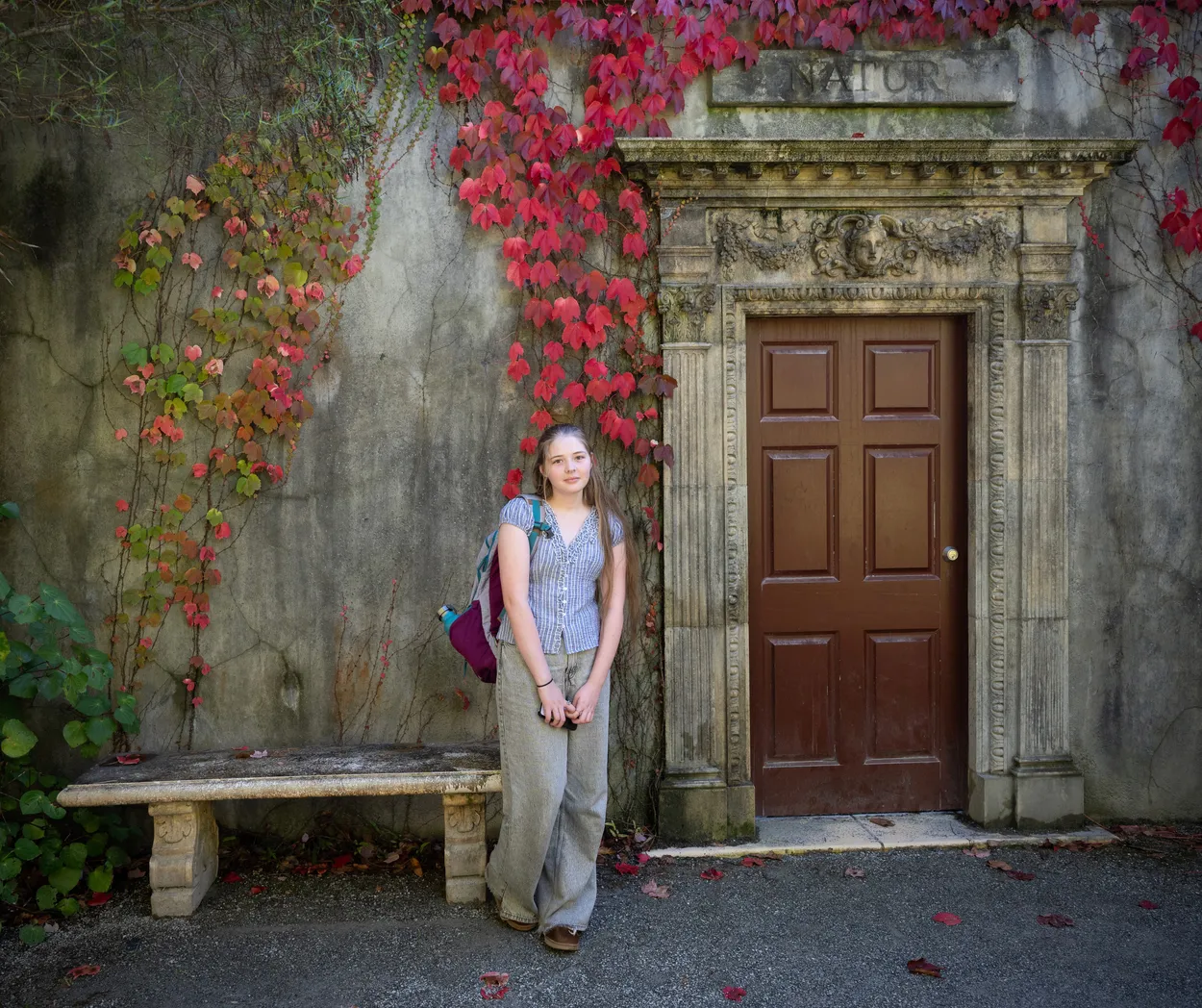 Girl By Doorway At Hamilton Gardens,New Zealand