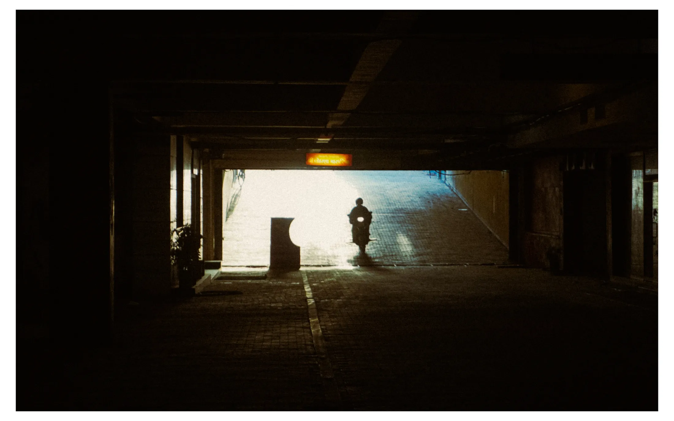 Scooter Entering the basement parking film-like shot
