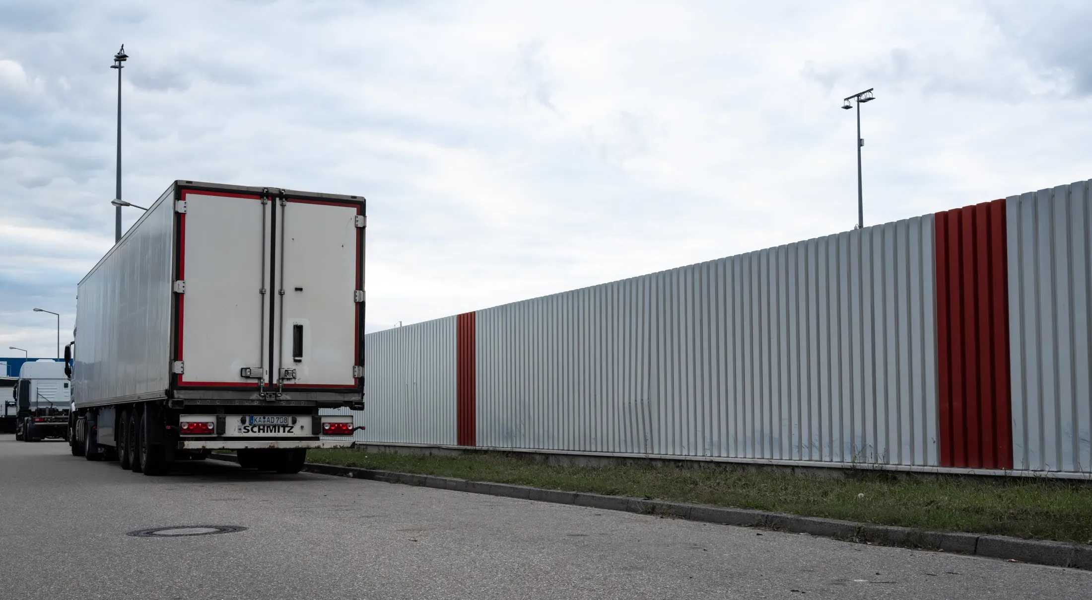 Truck in front of a Fence