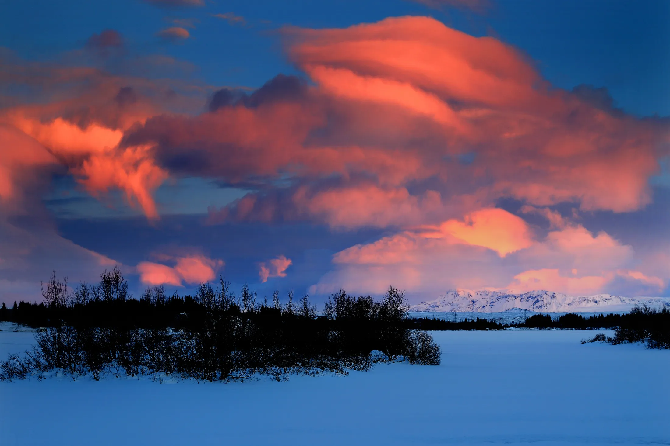 Clouds on fire at the lake, Iceland
