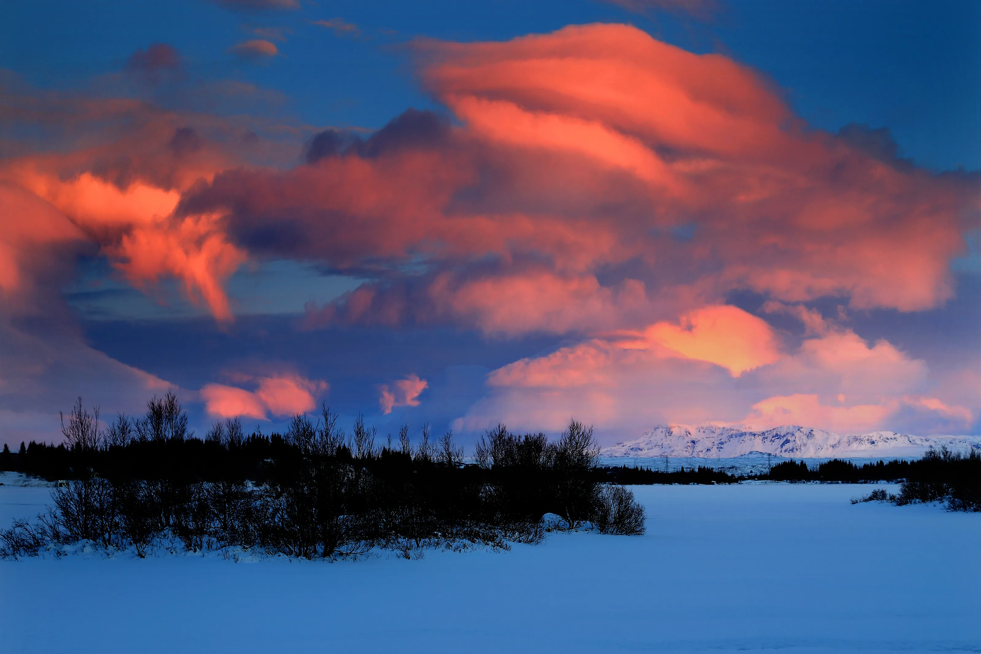 Clouds on fire at the lake, Iceland