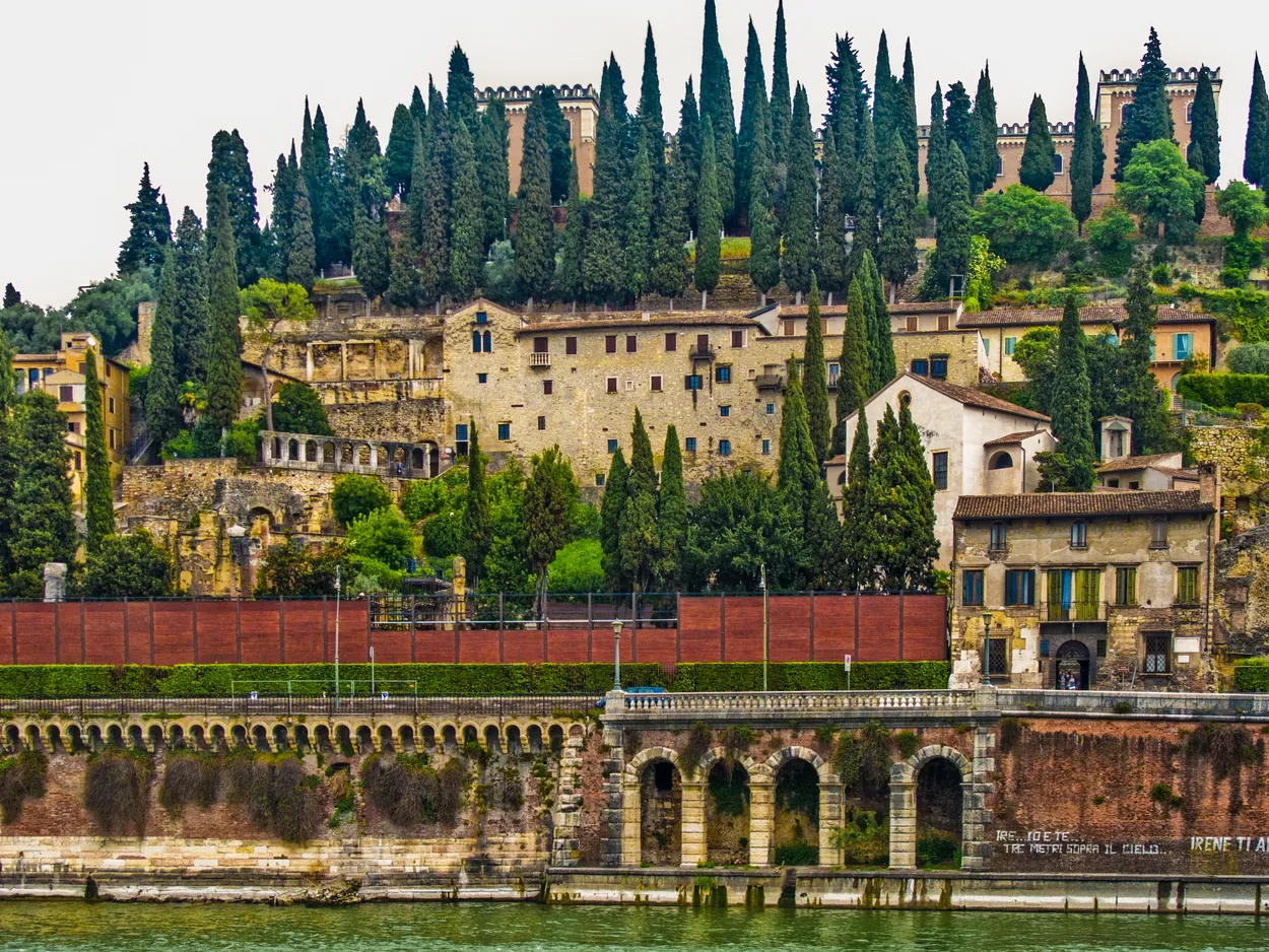 View of hillside with trees from Ponte Pietro, Verona, Italy